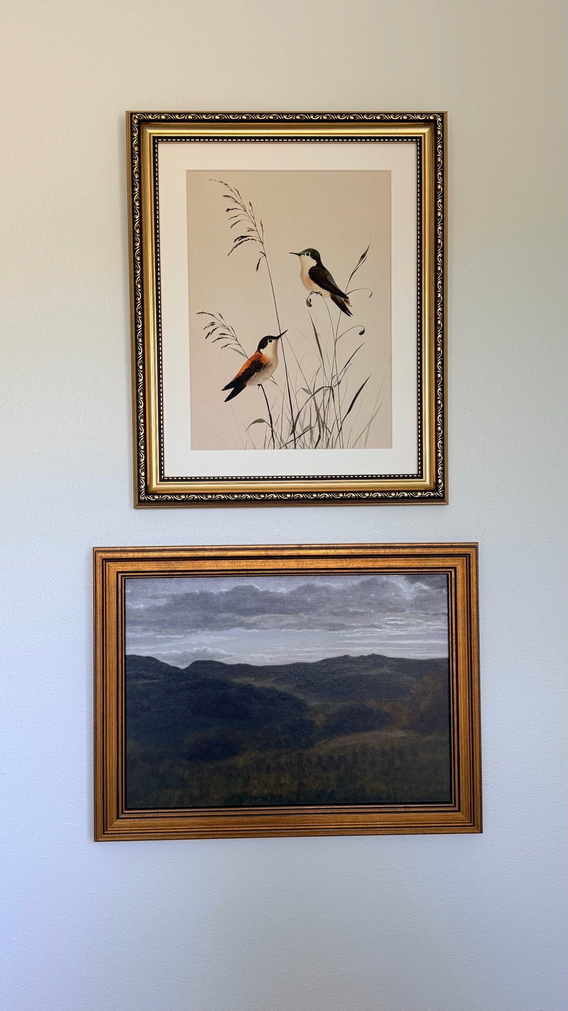 I am loving how these two pieces came together in my bathroom.

The moody mountain landscape canvas has such a dark, vintage feel with a gold frame that adds a bit of farmhouse charm. It is the kind of piece that brings depth and character to a wall without being too bold.

The hummingbird canvas is simple and pretty, with two hummingbirds in a soft vintage style and a matching gold frame. The color schemes of both pieces complement each other so well, and together they give the space a cozy, curated look.

#walldecor #farmhousedecor #bathroomdecor #vintagewallart #homedecorfinds 

 #LTKHome #LTKSaleAlert