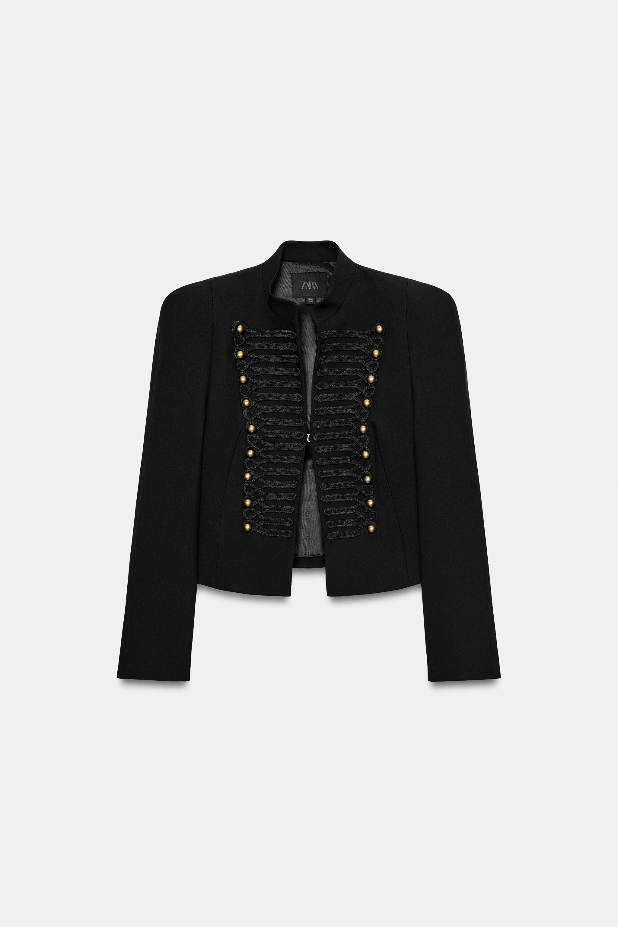 Round neck blazer with long sleeves and shoulder pads. Featuring tone-on-tone button and embroide... | Zara US