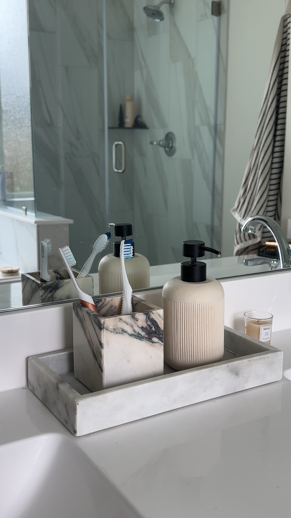 Loving my new bathroom set up! This viola calacatta marble canister that we’re using as a toothbrush holder is my favorite. I’ve had this soap dispenser for yeeears and it’s held up so well. Also Replica “Jazz Club” is one of the best scents they have! 🫧

#LTKHome #LTKBeauty