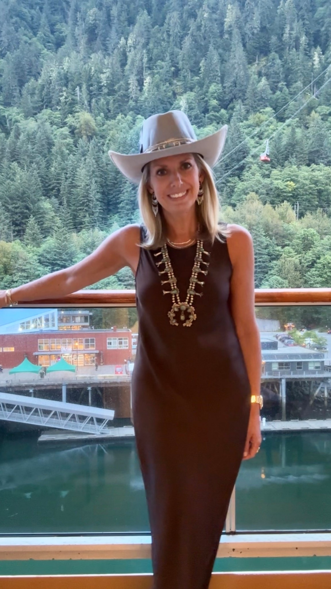 Simple brown satin maxi dress, but make it western! Just add a sweater as it’s getting cooler. Comes in many colors - I bought the burgundy also!

Cowgirl
Western themed
Turquoise Squash blossom 
Navajo jewelry necklace silver
Diamond ring
Fringe earrings
Cowboy hat 
fine jewelry
Gold necklace 
Strappy nude sandals
Alaska work Outfit 
Fall winter 
Suede bag 

#LTKFindsUnder100 #LTKOver40 #LTKWorkwear