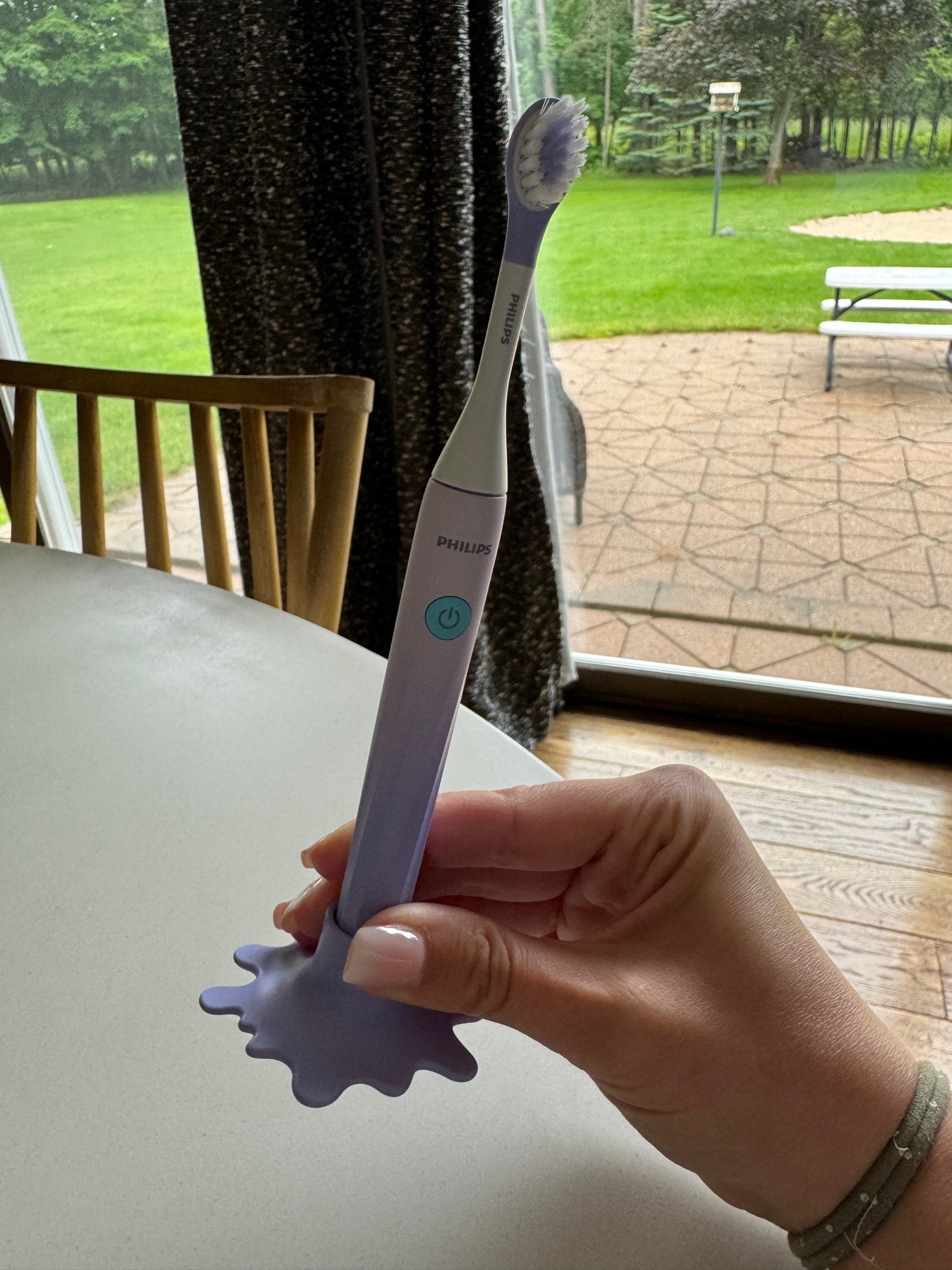 Powered by a AAA battery! Love the little stand! Kohls has the option for purple :) 