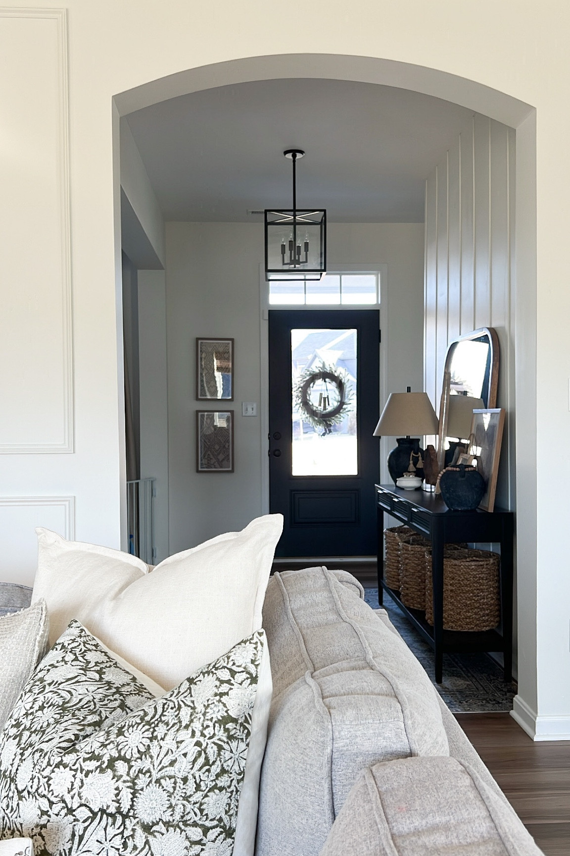 Love this view of our entryway! 

Chandelier, framed tapestry, target entryway table, wicker basket, lamp, wooden lamp, layered art, entryway, black front door 

#LTKhome