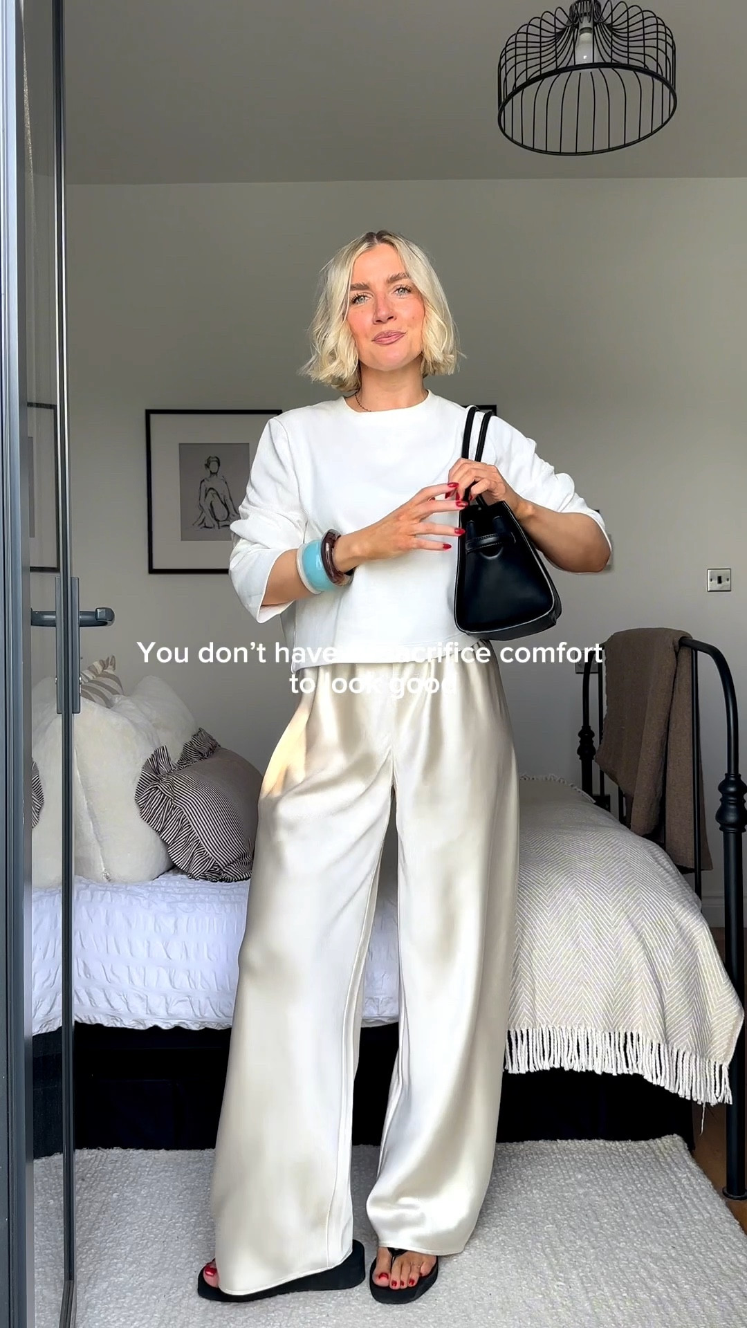 Satin trousers outfit 
Long sleeve white top
Black handbag
Chunky bangles 
Elevated basics 
Cream satin trousers 

#LTKstyletip #LTKsummer #LTKuk