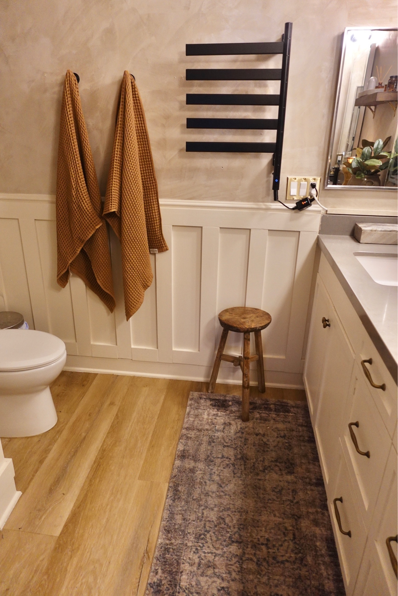 A vintage stool, textured cozy towels and a good rug runner are the perfect way to cozy up and style a bathroom.

#LTKhome #LTKstyletip #LTKMostLoved