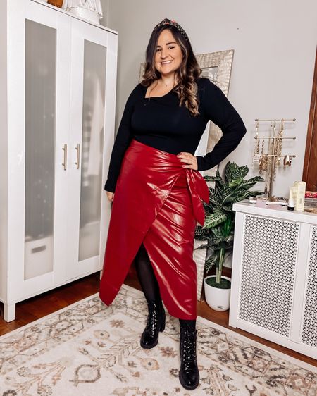 Wearing an XL in the asymmetrical body suit
Wearing an XL in the faux leather skirt
Linked similar heeled combat boots

Christmas party outfit, holiday party outfit, red skirt, black body suit 

#LTKHoliday #LTKcurves #LTKunder50