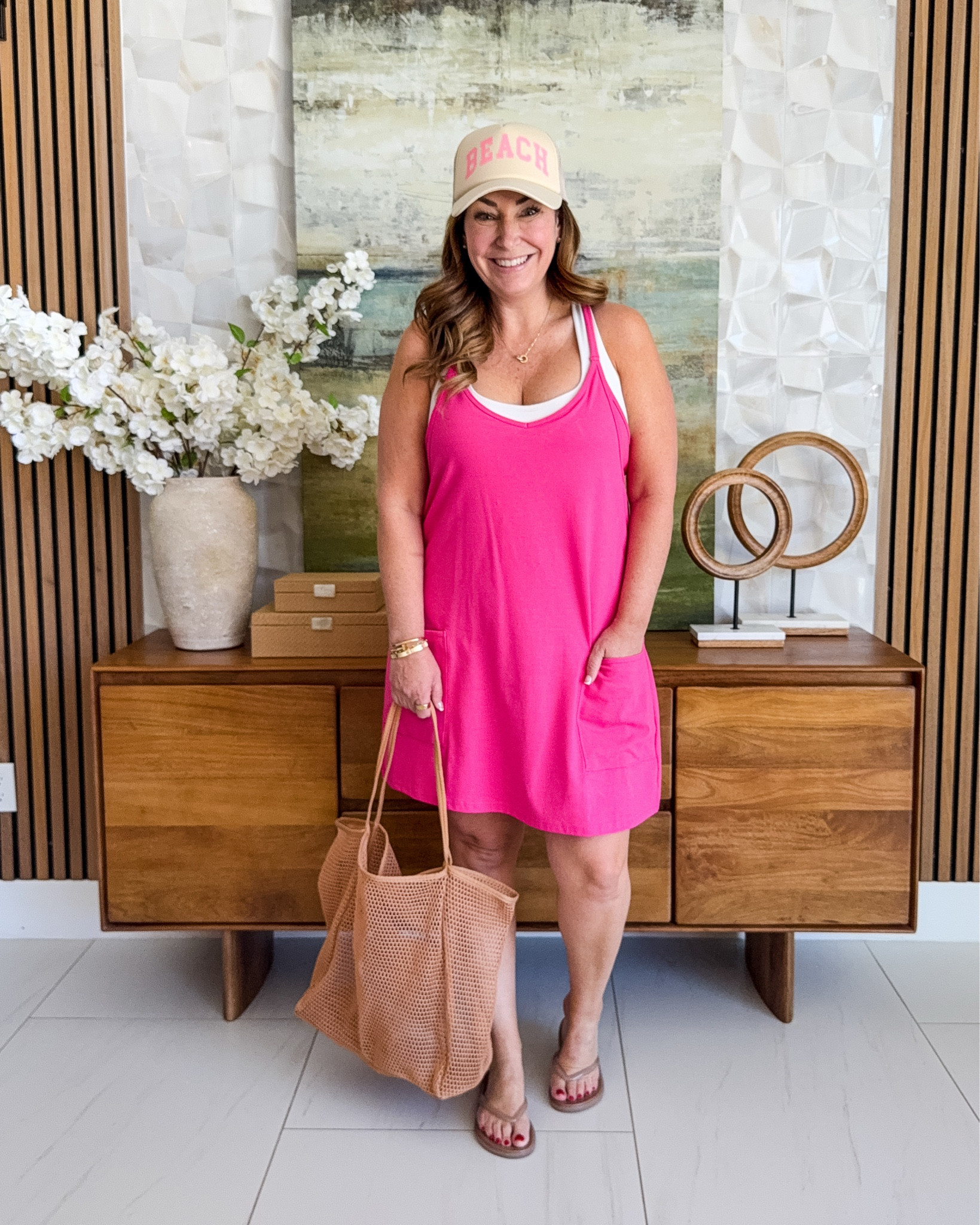 This one piece casual romper in magenta is double layered with built in shorts and a loose fit.  I'm wearing it layered with a sports bra, perfect for a casual beach day outfit or pool coverup! 

📏Sizing Tips: Wearing true to size, L

#LTKSeasonal #LTKOver40 #LTKMidsize