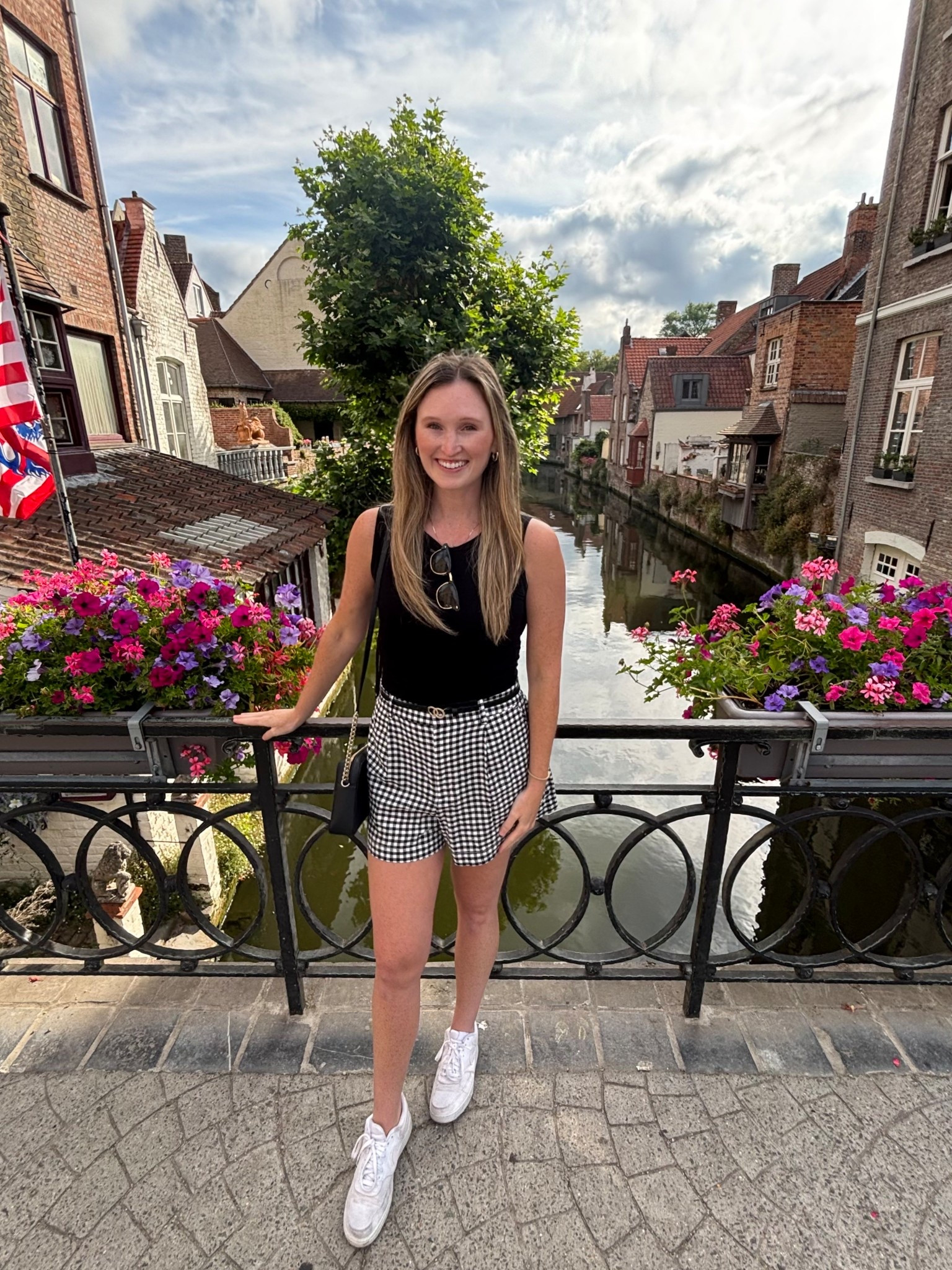 Casual Europe vacation outfit. Comfortable summer travel outfit. Gingham shorts (size down) with black ruched tank. White comfort shoes for walking with black purse. 


#LTKFindsUnder50 #LTKSeasonal #LTKTravel