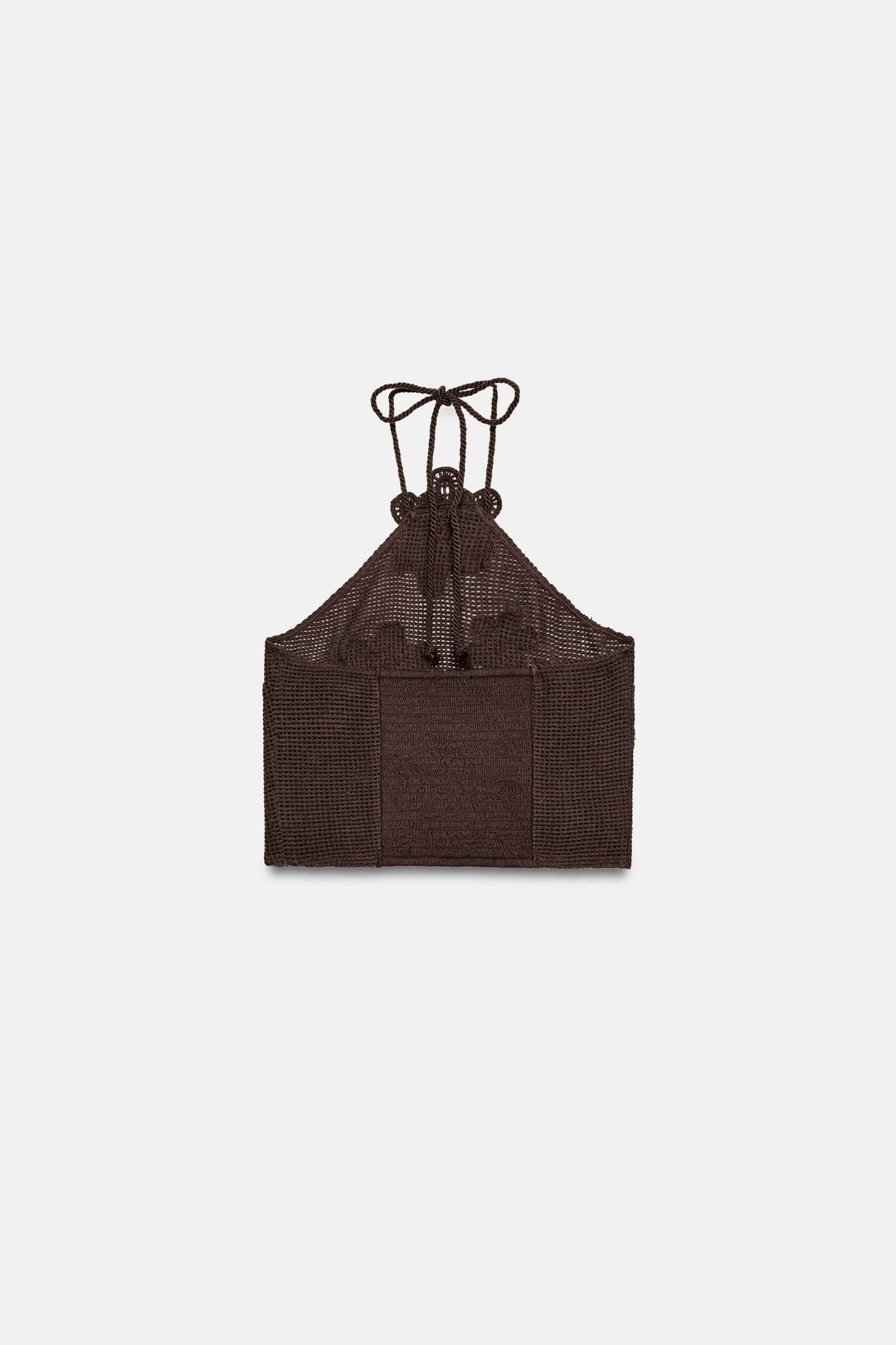 Halter neck top with tie fastening. Structured fabric with flower motifs and bead details. Featur... | Zara UK