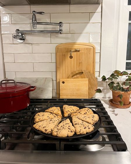Chocolate chip sourdough scones 😋 Cutting boards behind the stove to add some interest & also because we don’t have a lot of storage in our kitchen 🤷🏻‍♀️

#LTKhome #LTKGiftGuide