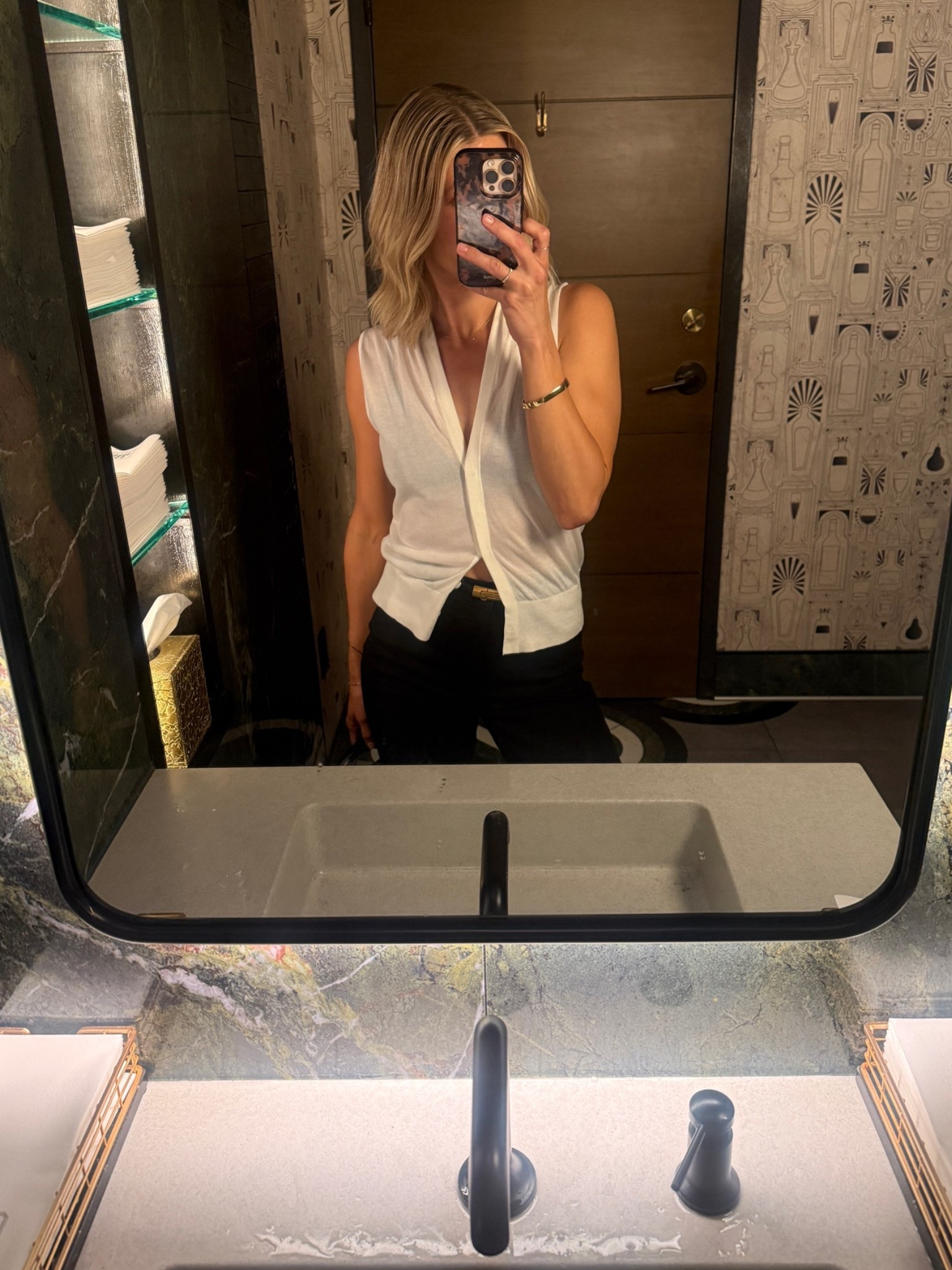 Wearing small vest, 26 jeans, small belt and heels tts