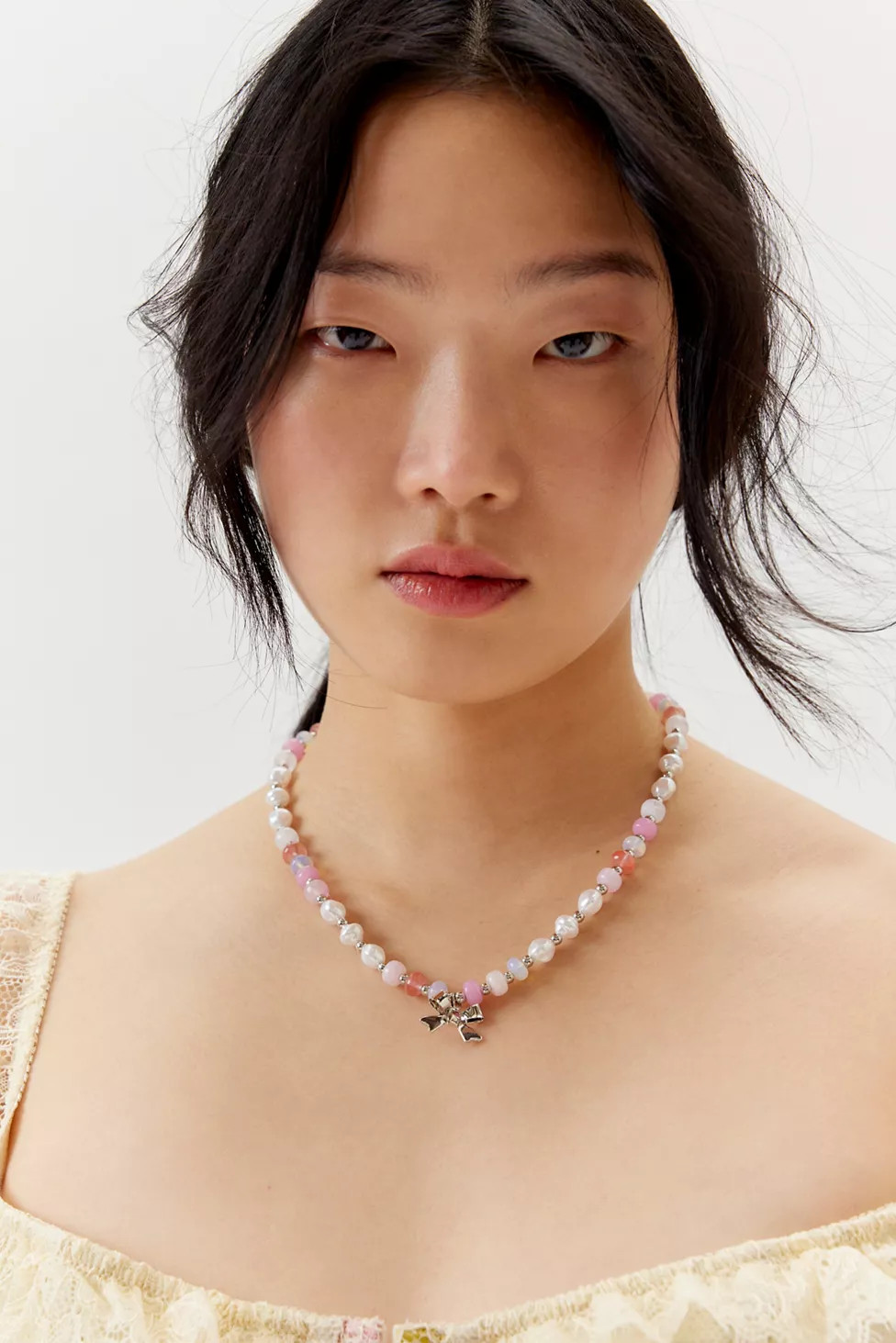 Pearl Beaded Bow Charm Necklace | Urban Outfitters (US and RoW)