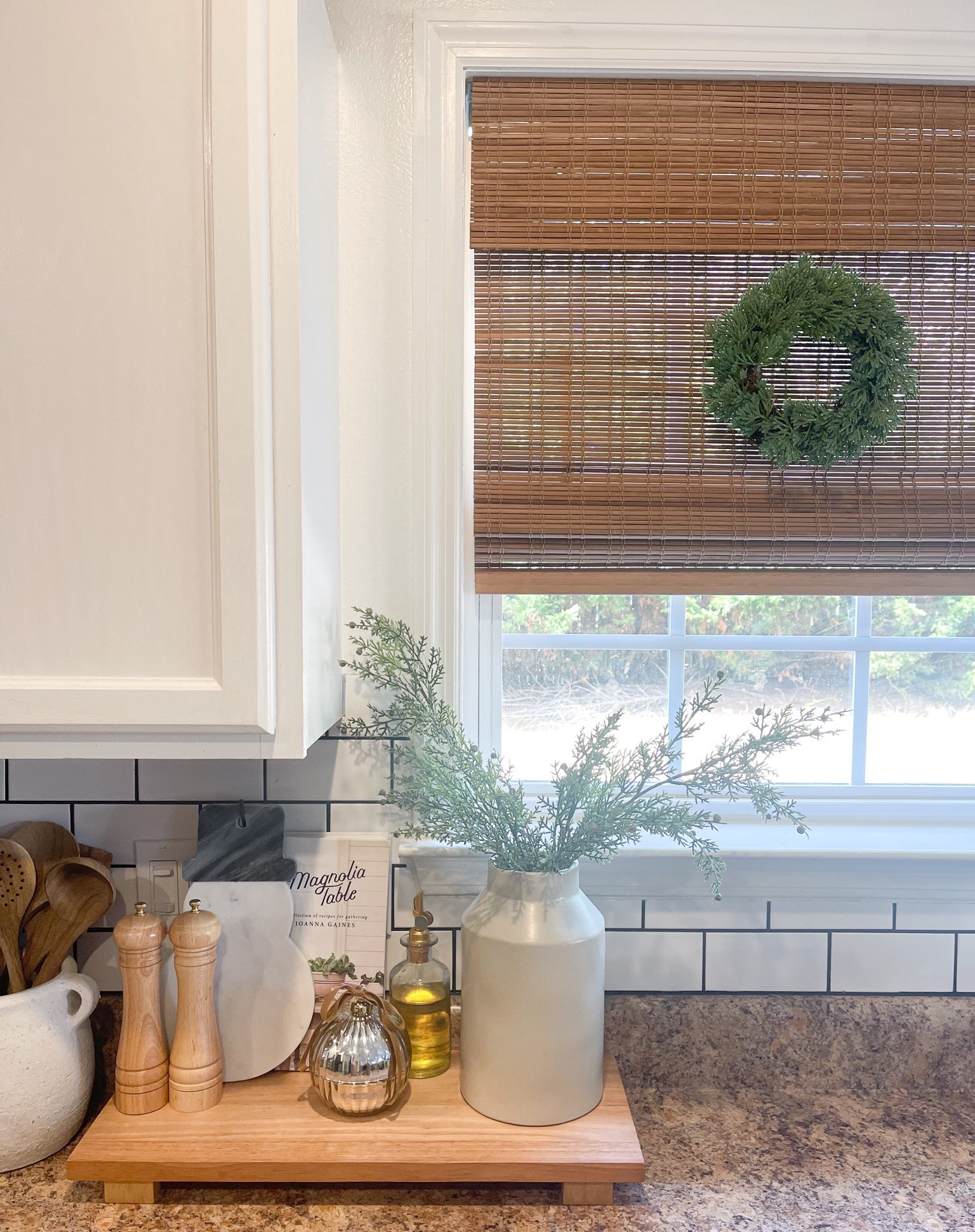 Kitchen Christmas/winter/ holiday decor. Tray styling ideas for Christmas. Mini wreath. Christmas stems. Ornament candle. Salt and pepper grinder set. Wooden spoons for kitchen. Bamboo Roman cordless shades. Marble snowman tray. 

#LTKHoliday #LTKhome #LTKGiftGuide