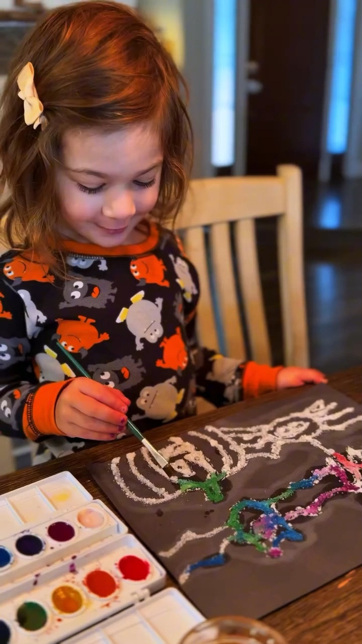 Not-so-spooky Halloween characters got a colorful makeover.

Some projects just never get old, and this one didn’t disappoint. Glue, salt, and watercolor—a simple classic we come back to again and again.

My little princess grabbed every color she could find. Even the white, brown, and black made it in, turning our salted spookies into a rainbow masterpiece.

Her favorite part? Watching the watercolors race and spread. Here’s how it works (hello, “science talk”): salt is super absorbent, so it pulls the liquid along with it.

That’s why we love process art—it’s about the magic of watching it unfold. And no, we’re not saving the salty flakes after. 🤪

#halloween #kidsactivitiesathome #saltpainting #spookyseason #preschool #kidsart #science

#LTKFamily #LTKHalloween #LTKKids