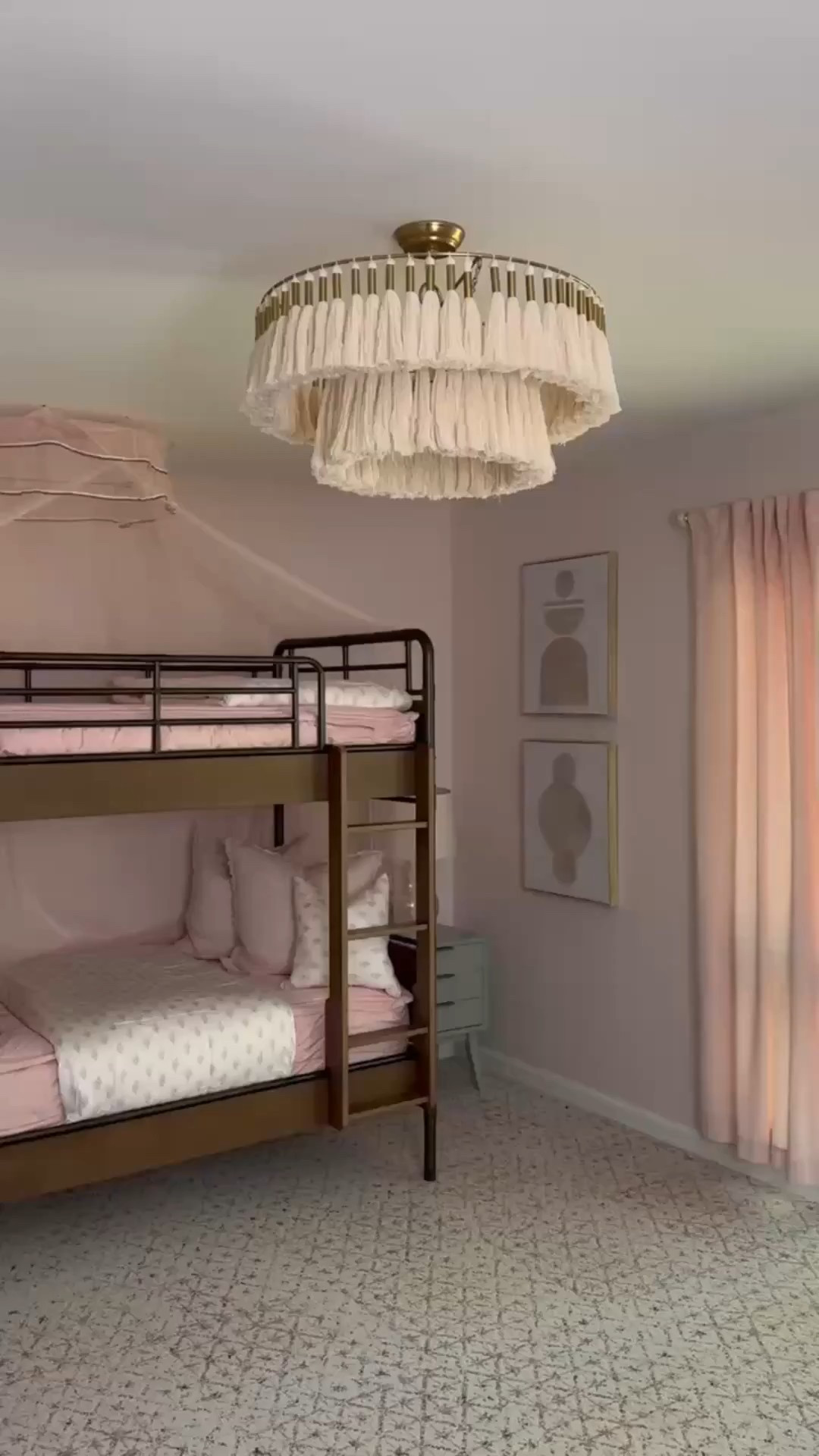 💗 From the tassel flush mount chandelier to the metal bunk bed, this dreamy space is layered in soft blush tones and cozy textures. The pink curtains, abstract wall art, and patterned bedding bring it all together with that perfect balance of fun and refined 🎀

Would you sleep top bunk or bottom? 😍👇

#MissionPink #GirlsRoomGoals #BlushDecor #BunkBedStyle #TasselChandelier #KidsRoomDesign #SoftTextures #PinkPalette #InteriorInspo #eanesinteriors


#LTKOver40 #LTKHome #LTKvlog