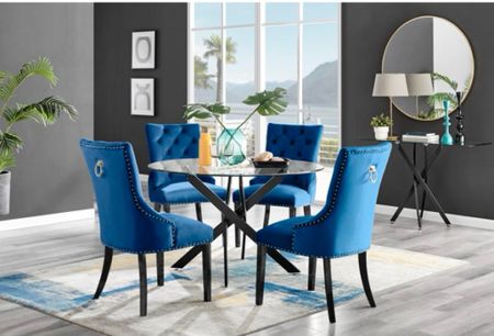 Enjoy a new glass dining table for the entire family! The Tierra 4 Seat Round Dining Table Set Black Legs and Glass with 4 Modern Velvet Dining Chairs is ON SALE and is under $950.

Keywords: Modern dining, modern dining table, modern dining table set, glass dining table, dining table set, round glass dining table set, dining room, home 

#LTKHome #LTKSeasonal #LTKSaleAlert