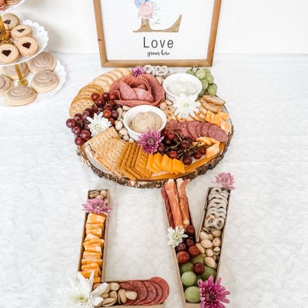 It’s so easy to make your own “cute” charcuterie board

Just get:
•A Ready-to-go charcuterie cheese/ meat tray 
•Fresh Fruit 
•Nuts 
•Pretzels 
•Crackers 
•Dips
•Artificial or real flowers 
(if you’re using real flowers, make sure to cover the stem with clear saran wrap) 
•Platter/ cardboard letters 
• Parchment paper

Arrange in a cohesive manner and that’s it! You just made a beautiful charcuterie board!✨

#LTKfamily #LTKkids party idea, summer, 

#LTKStyleTip #LTKParties #LTKFamily