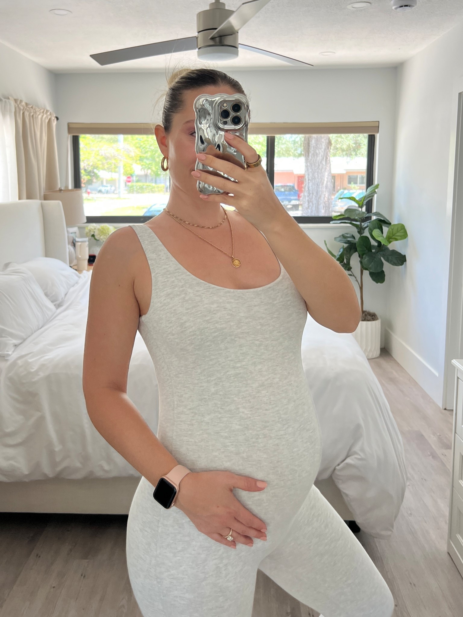 Wearing the cotton maternity unitard in heather grey size M 