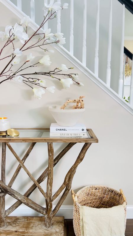 Get your home fall ready with warm and inviting textures and colors! Shop my fall entryway here!

Teak console table 
Ceramic bowls 
Ceramic vase 
Magnolia stems 
Decorative books 
Candles 



#LTKCon #LTKSeasonal #LTKhome