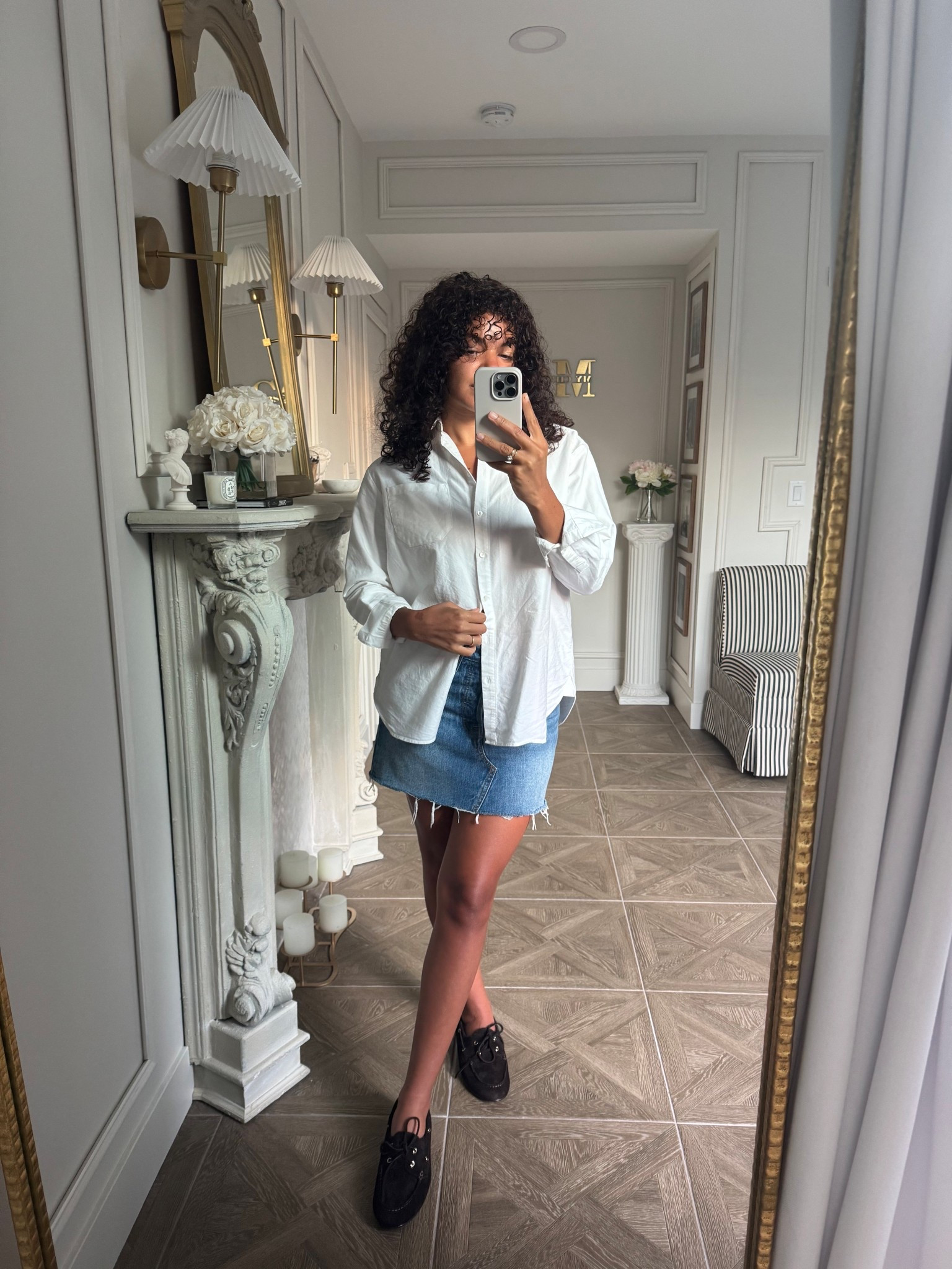 Early fall outfit: denim mini skirt, boat shoes, and an oversized button up 

#LTKSeasonal #LTKStyleTip