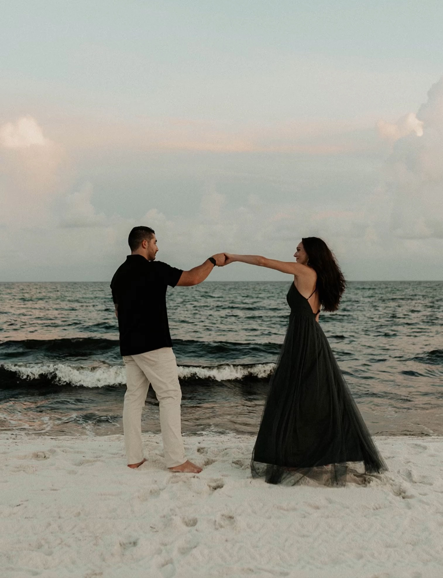Dark tulle flowy maxi dress with a black or grey tone. Perfect dress for a beach engagement photoshoot. #engagementoutfit #bridaloutfit #tulledress 

#LTKtravel #LTKSeasonal #LTKwedding
