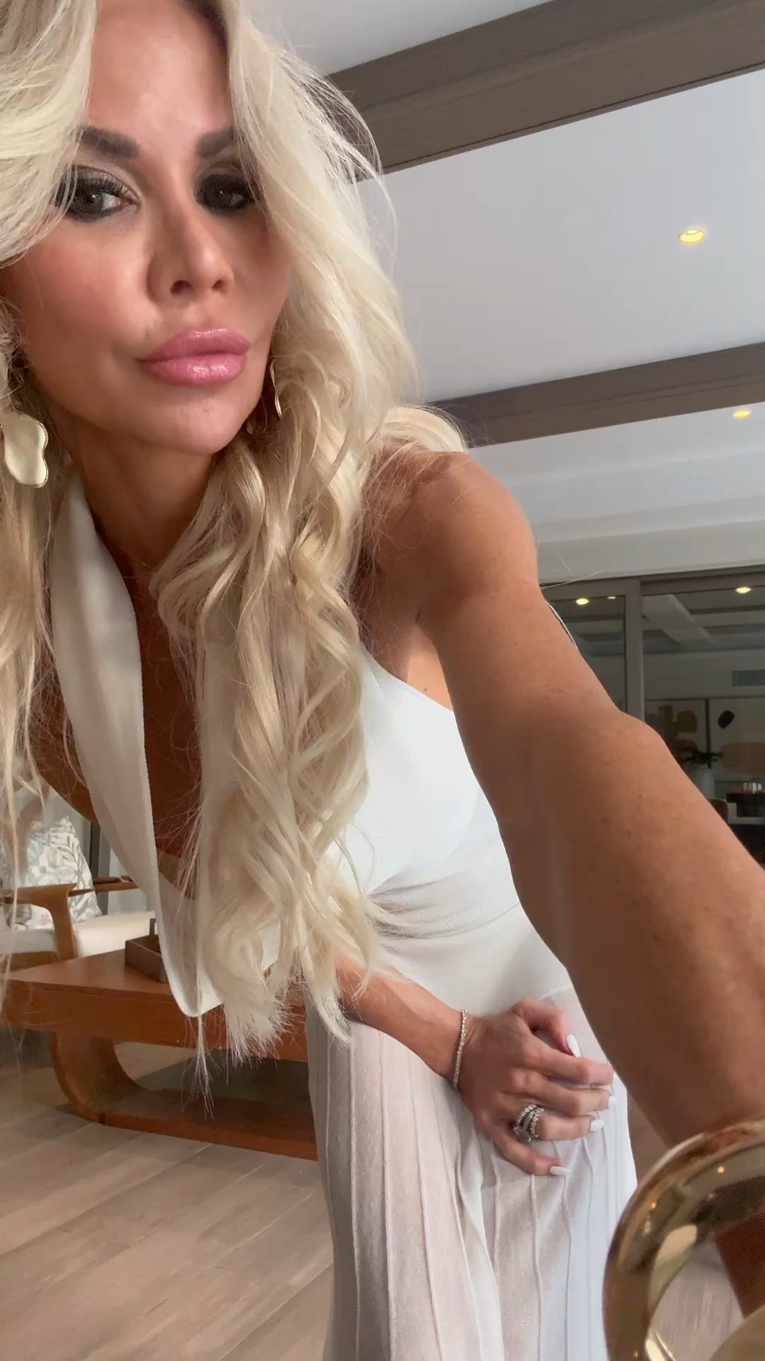 Having a cloud dancer moment for the Pantone color of 2026. ☁️☁️This Helsa dress from FWRD has a gorgeous soft cowl neckline, curve-skimming knit, and sheer hem detail that keep it minimal but memorable so you look styled without overpacking. 