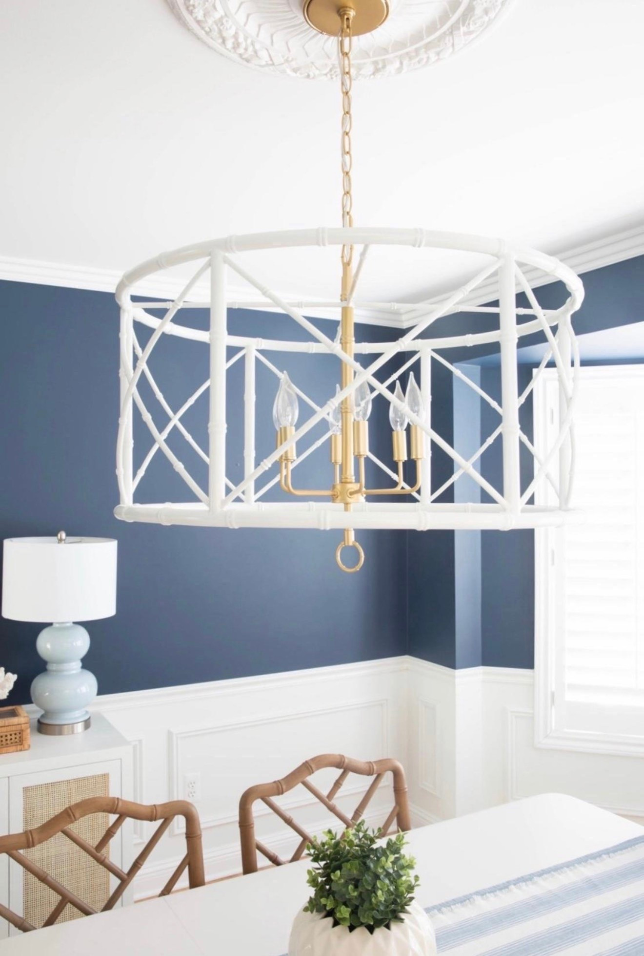 This white bamboo chandelier is the statement piece in my coastal dining room, adding natural texture and effortless coastal style. I love how it softens the space and pairs perfectly with blue and white decor for a bright, designer-inspired look.

#LTKHome #LTKSaleAlert #LTKU