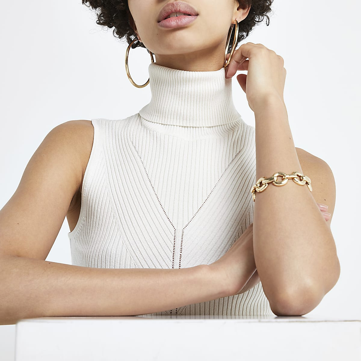 Cream ribbed roll neck sleeveless top | River Island (UK & IE)