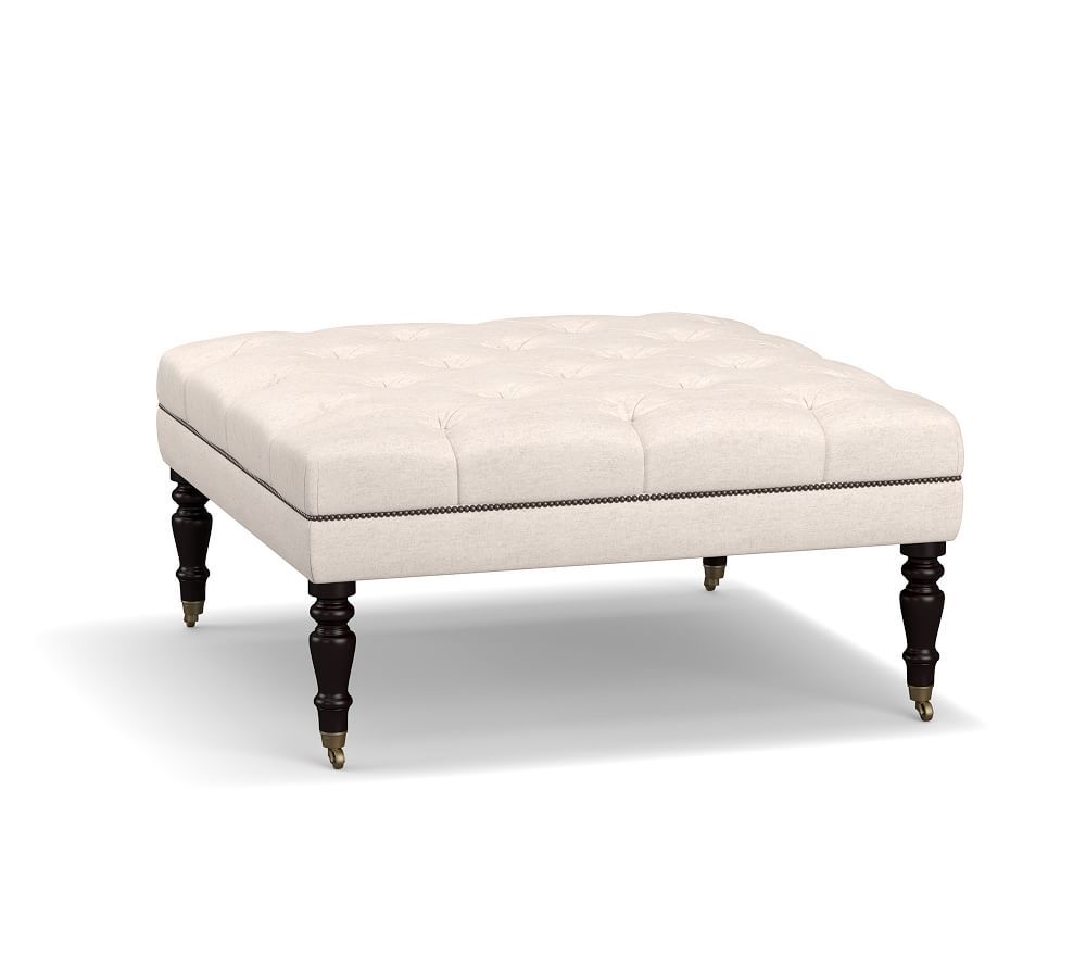 Raleigh Upholstered Tufted Square Ottoman with Turned Black Legs & Bronze Nailheads, Performance ... | Pottery Barn (US)