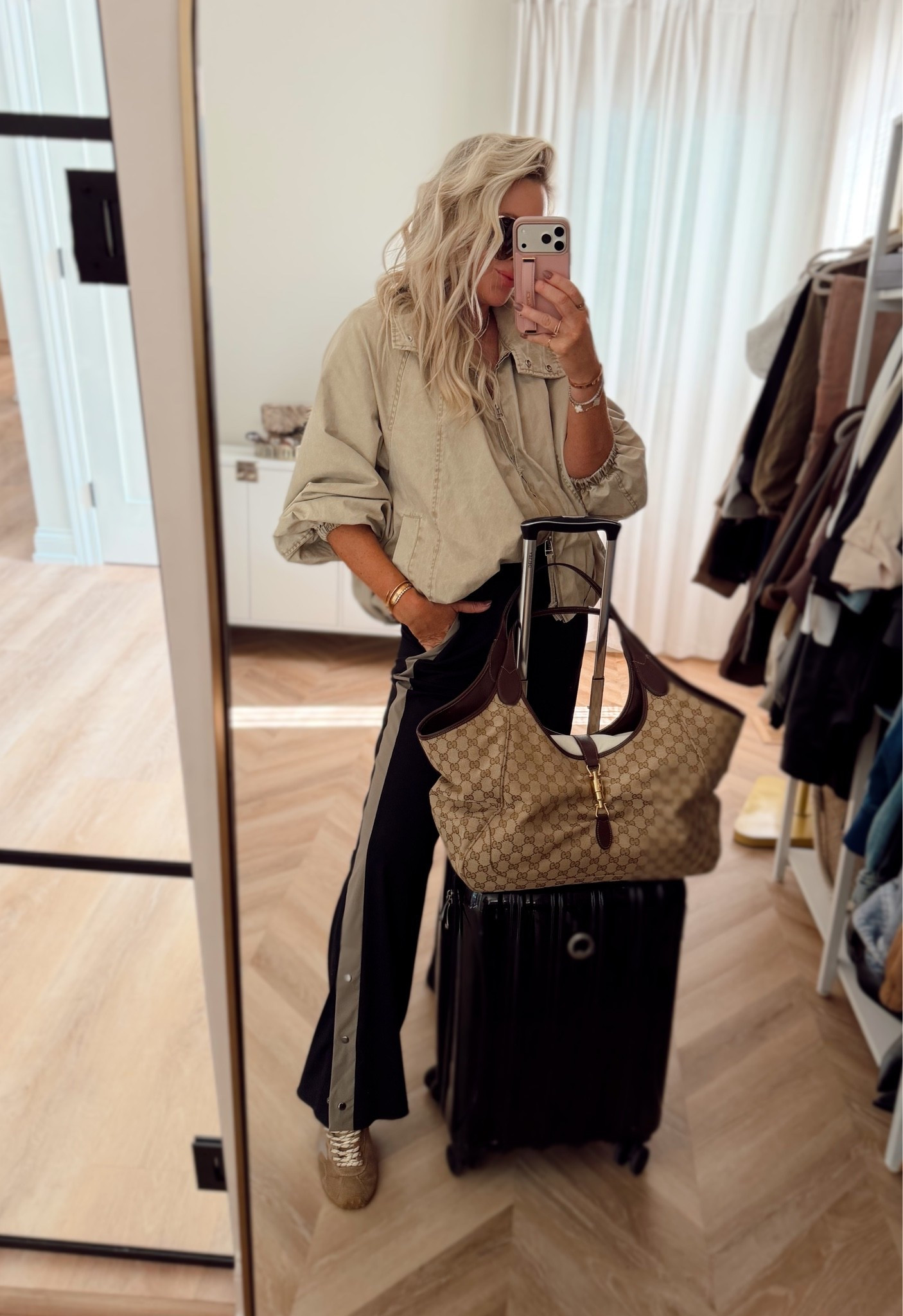 Airport outfit, but make it chic! ✈️ My favorite travel jacket is FINALLY back in stock, and these track pants are the perfect mix of sporty and comfortable without looking sloppy. This is exactly what I want to wear for a travel day! 🤎

Airport outfit ideas, travel outfit for women, casual chic travel style, track pants outfit, fall travel essentials