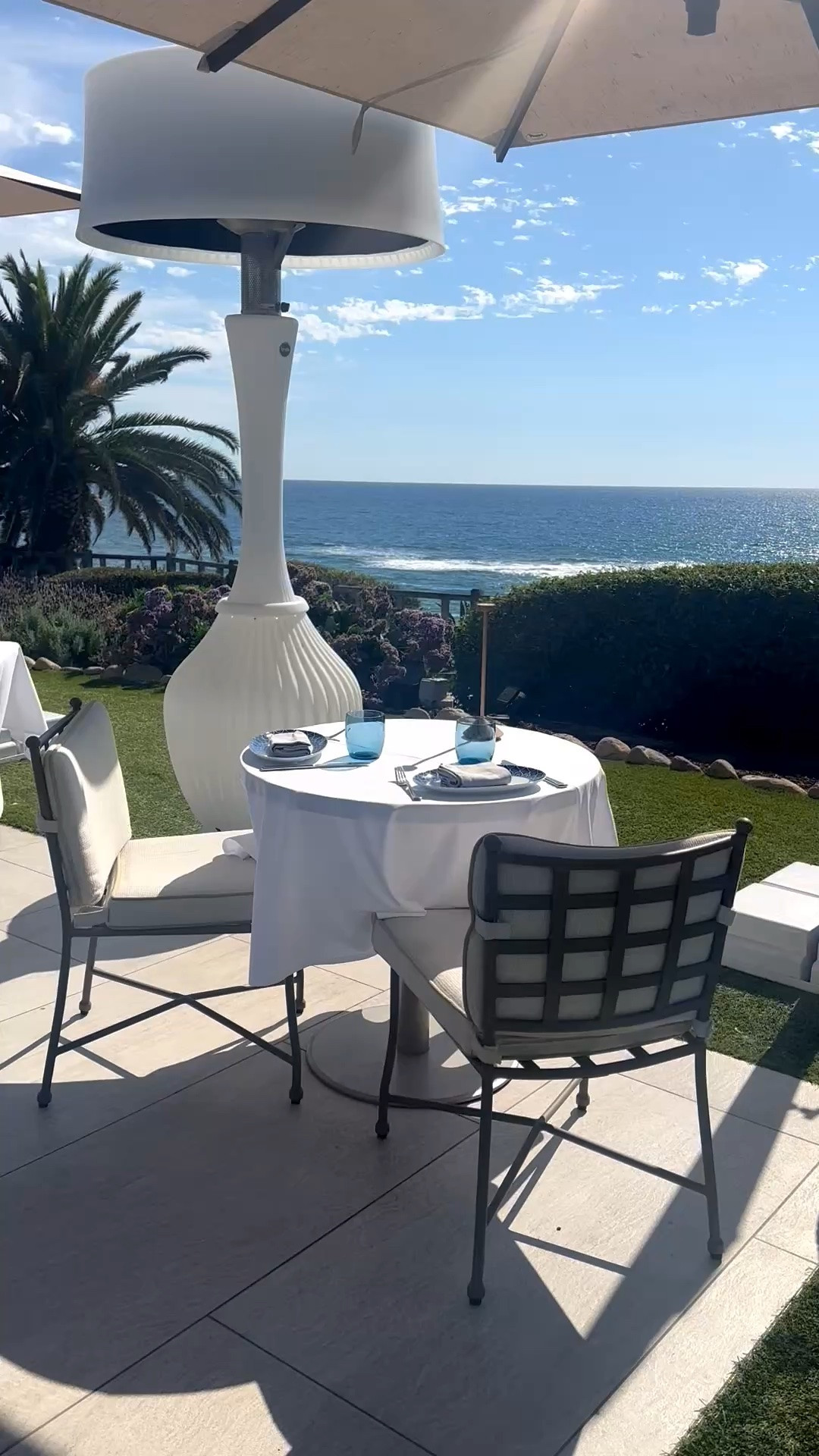 Al fresco dining with an endless blue-sky-and-ocean view 💙

I especially love this modern classic outdoor dining set—the clean metal frames feel tailored and timeless, while the lattice-back chairs add just enough architectural detail. Paired with a crisp white tablecloth, the entire setting feels elegant, effortless, and forever in style.

A beautiful reminder that outdoor dining doesn’t need to be complicated: timeless furniture, classic white table linens, sunshine, and a gorgeous view are all you need.

#LTKHome #OutdoorDining #AlFrescoDining #OutdoorDiningSet #OutdoorDiningTable #OutdoorDiningChairs #PatioFurniture #PatioDining #OutdoorEntertaining #Tablecloth #TableLinen #Tablescape #ModernClassic #CoastalStyle #CoastalLiving #OutdoorLiving

#LTKdayinmylife #LTKHome #LTKSaleAlert