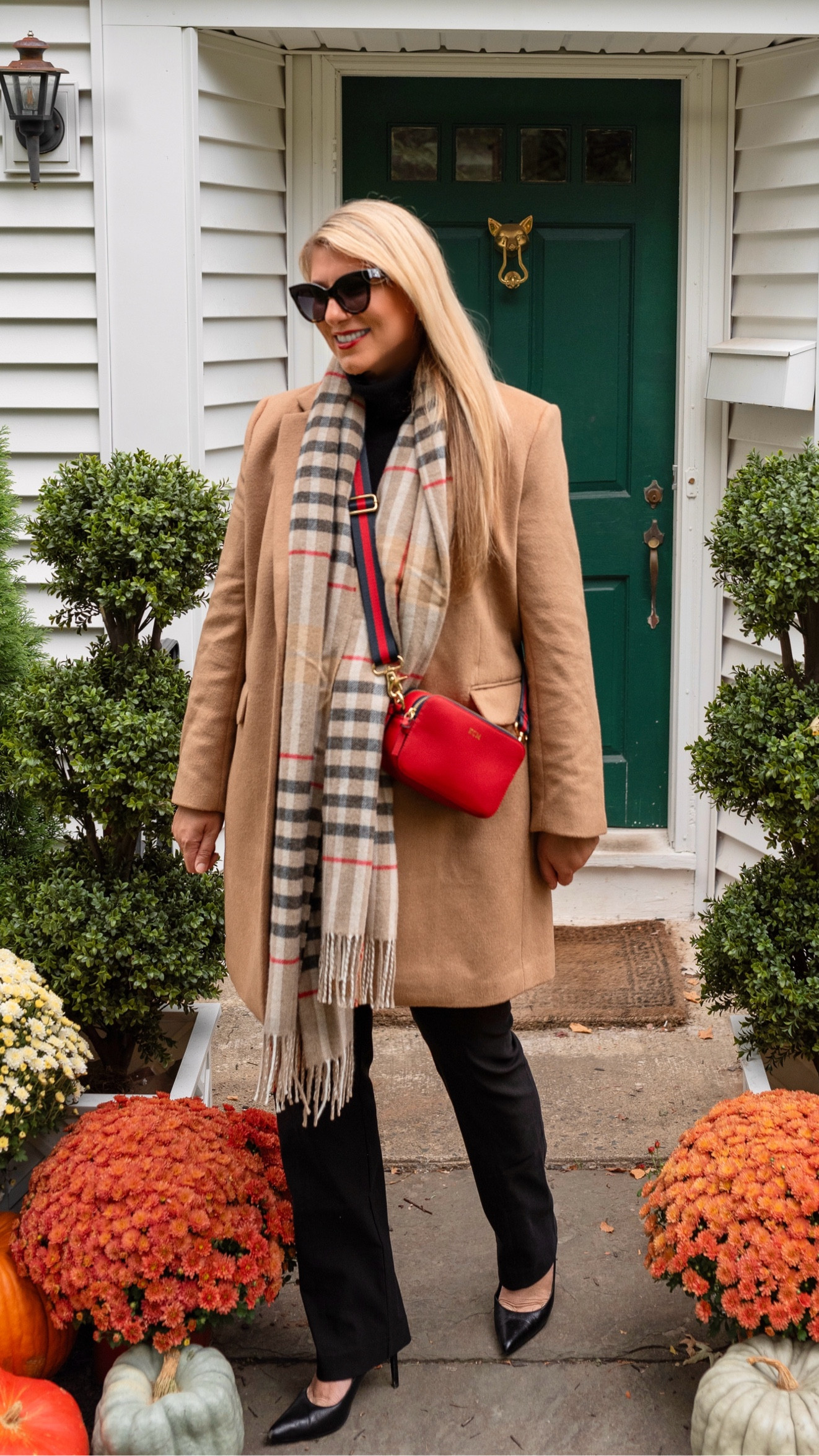 Fall layering season is here. Camel Wool Coat, London Plaid Wool Scarf, Red Leather Crossbody Bag, and black turtleneck, pants, & pumps

#LTKItBag #LTKSeasonal #LTKOver40