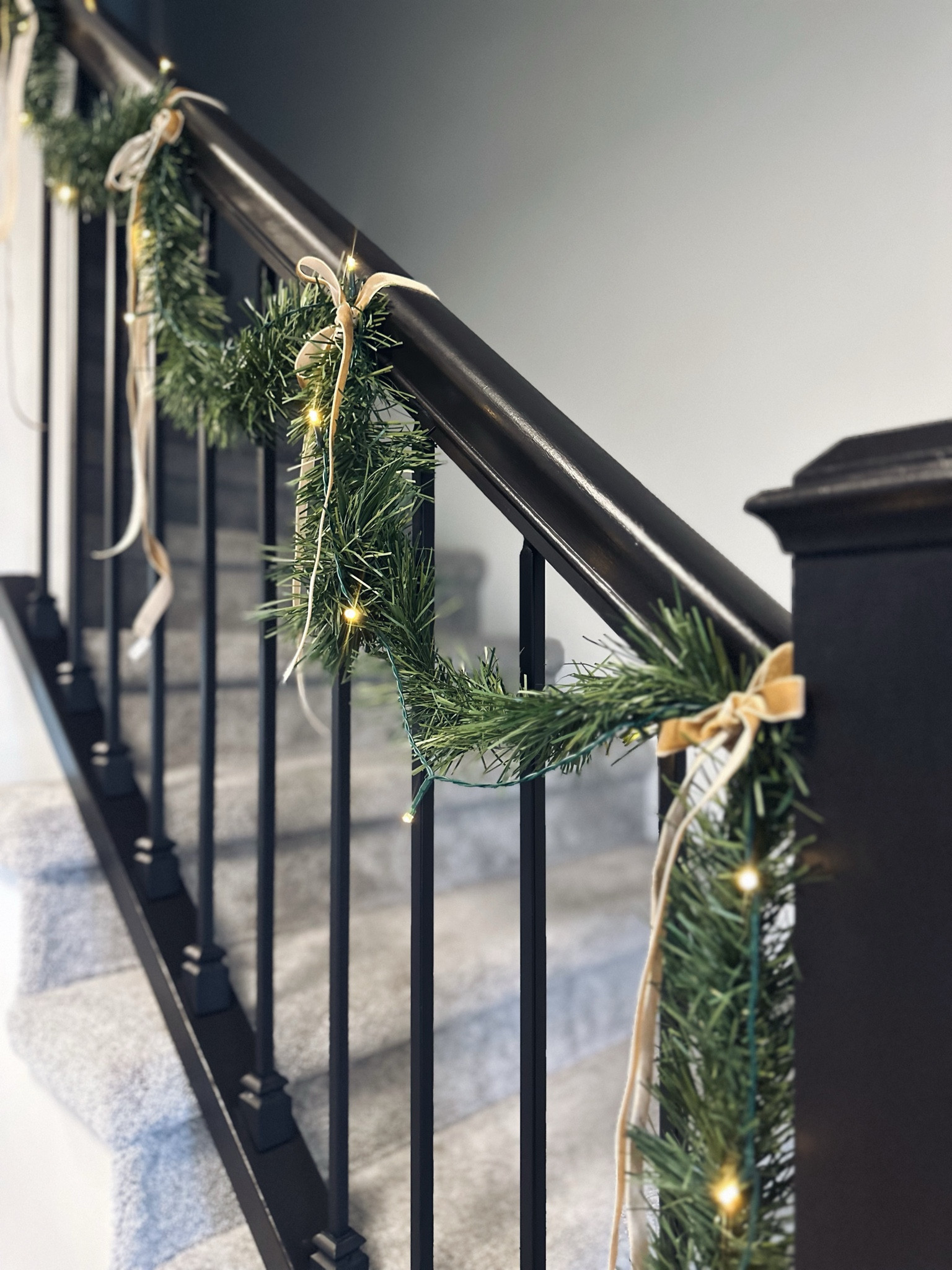 Made my stairway look a little festive too. I love simple decor 🤎 I used regular garland with battery operated wire lights, but I have also found some cute ones already pre lit. 

#LTKhome #LTKHoliday #LTKSeasonal