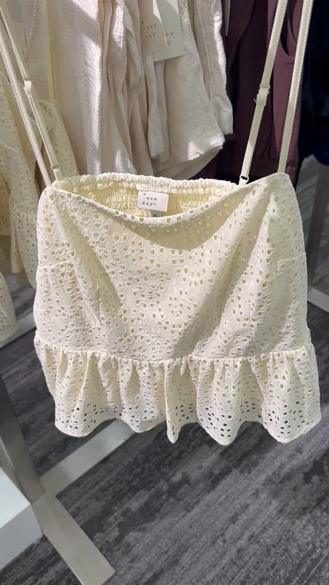 Add a touch of timeless charm to your casual wardrobe with this Peplum Tank Top.