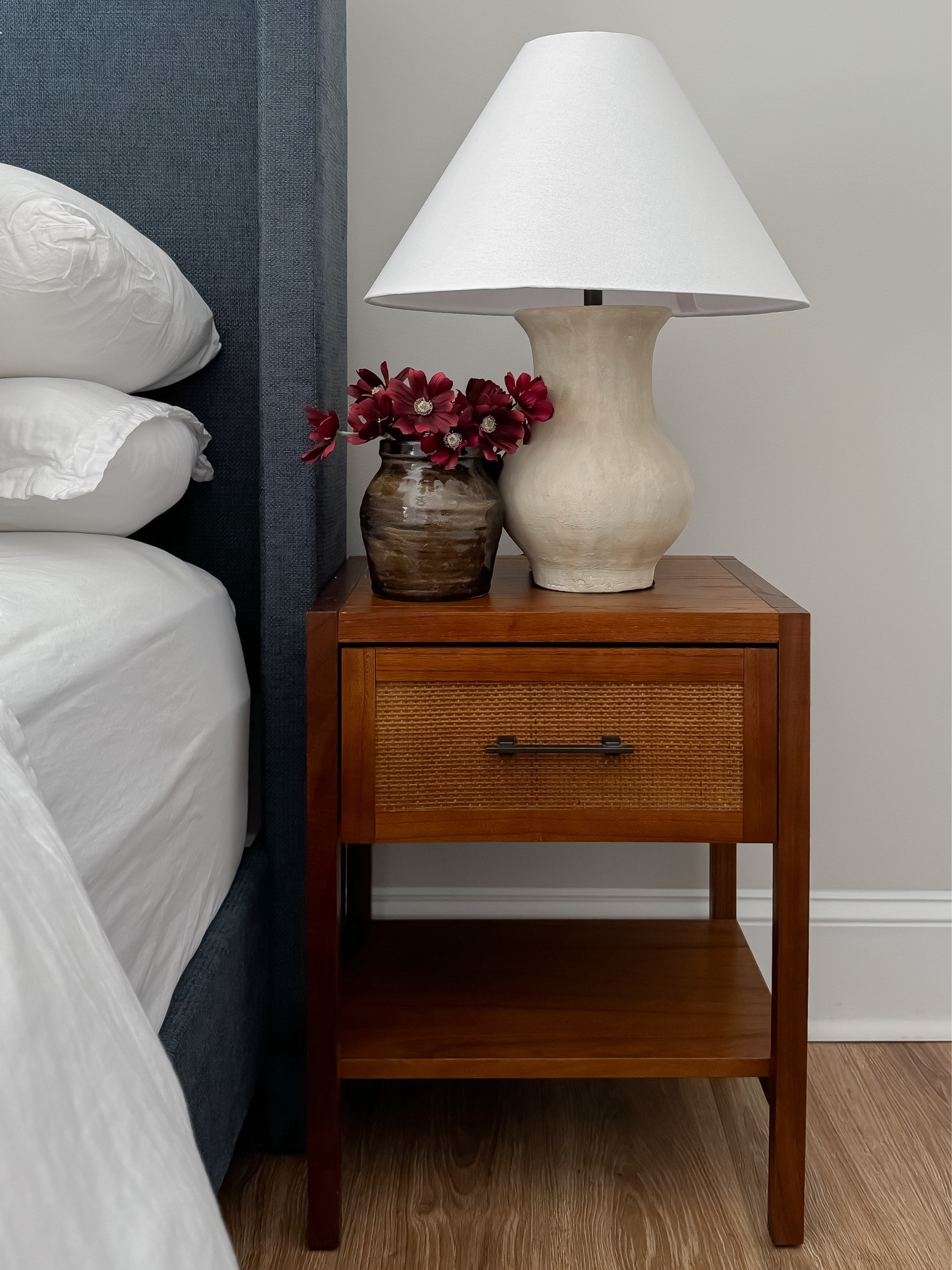 Bedside table, lamp and vase with faux flowers 🌺 

#LTKFallSale #LTKSaleAlert #LTKHome