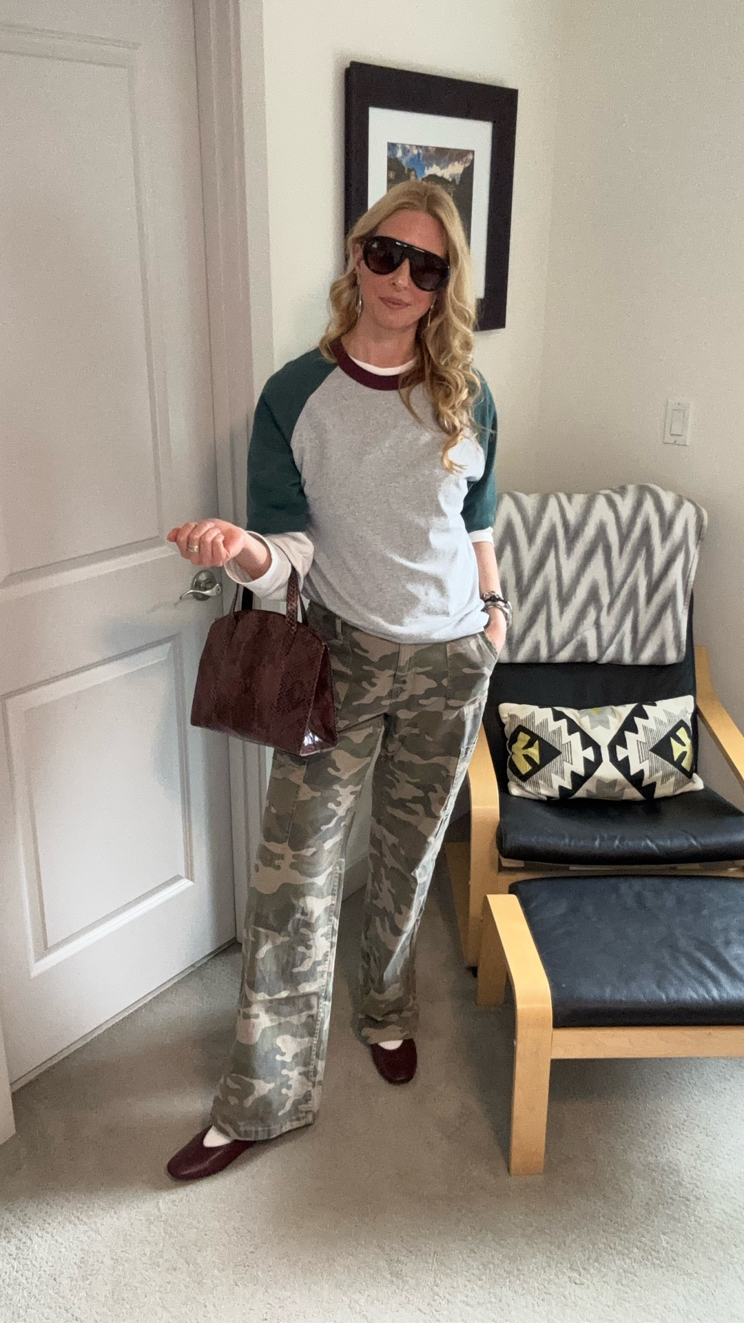 I’m not a stylist, but in my opinion this outfit works because of some intentional styling. 

Layering, an asymmetrical shirt tuck and adding in tension with accessories by pairing more formal pieces with the relaxed silhouette. 

Long sleeve tee @gapstyle 
Raglan men’s tshirt @uniqlo
Camo pants @walmart
Mary Jane shoes @oldnavy
Snake print vintage @gucci bag and @givenchy earrings @ebay 