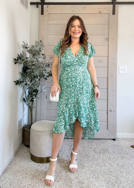 Floral wrap dress / wearing size medium but it’s snug - I would suggest true size (I’ve had this since before my first baby) / bump friendly and comes in lots of colors / 5 foot 7 inches tall / mom dress / spring dress / Easter dress / summer dress / midsize outfit inspo

#LTKfindsunder50 #LTKstyletip #LTKSeasonal