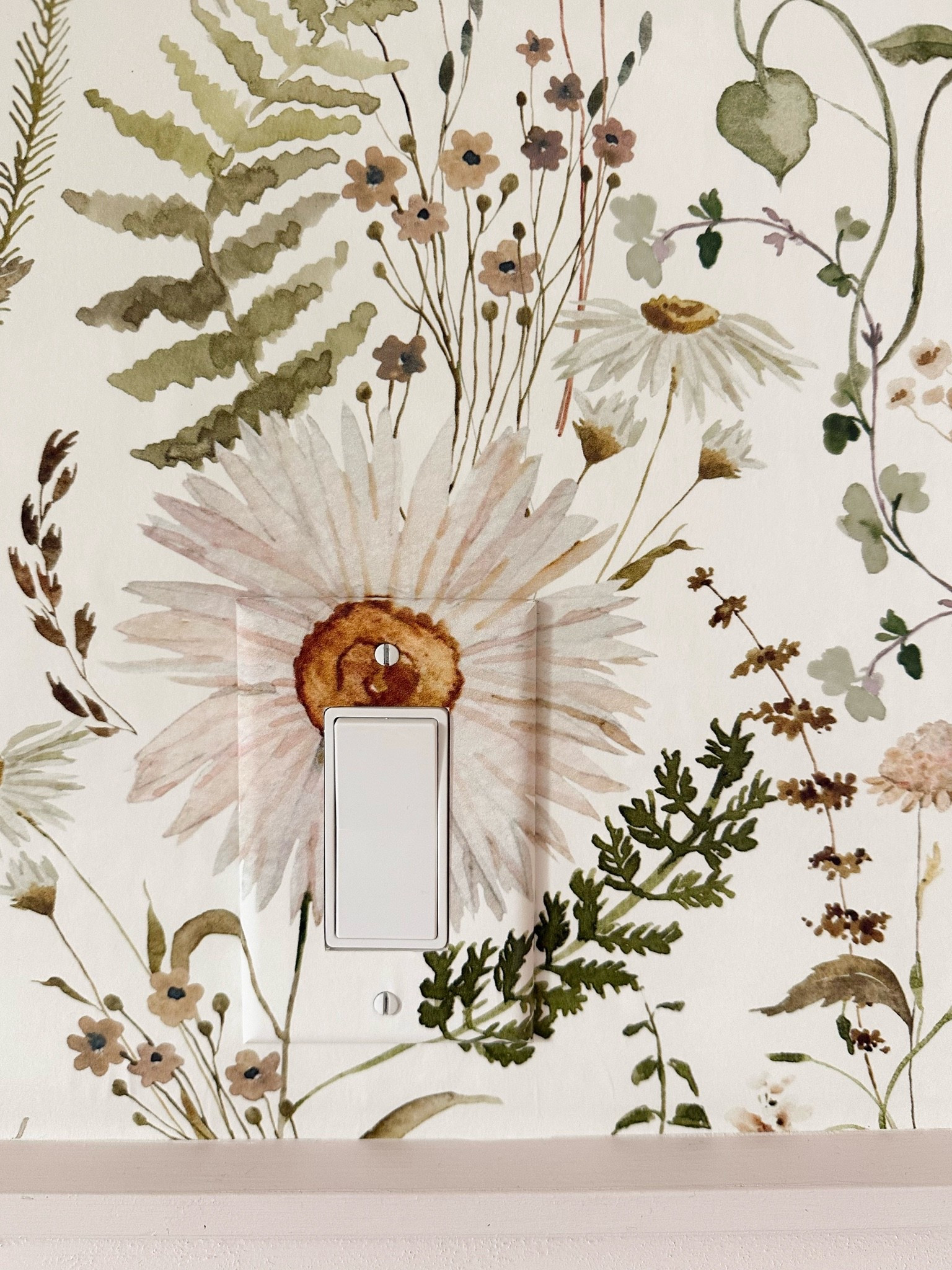 This floral wallpaper is such a pretty way to bring personality into a small space. I love the soft mix of blush, green, and warm neutrals, and how even the light switch blends right into the pattern.

floral wallpaper, botanical wallpaper, girls room decor, nursery wallpaper, kids room inspiration, feminine home decor, soft neutral wallpaper, botanical home decor, wallpaper ideas, classic interior design, playful wall decor, girlonthehudson

#LTKHome #LTKKids #LTKmomlife