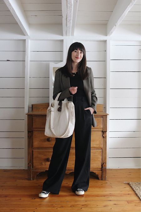 Casual black trouser styling - Look 2/4 - For this look I mixed suiting with sneakers and a soft tote and the result is an off-duty corporate cool vibe. I love this one for after hours like meeting friends after work. 

Blazer is old Reformation - similar linked

Supima Micro Rib Tee - tts - These are my favourite tees. 

Way high drape pant - tts - Wearing my usual 4 with the 32” inseam

70’s Chuck Taylor High Top - tts 

#LTKstyletip #LTKSeasonal