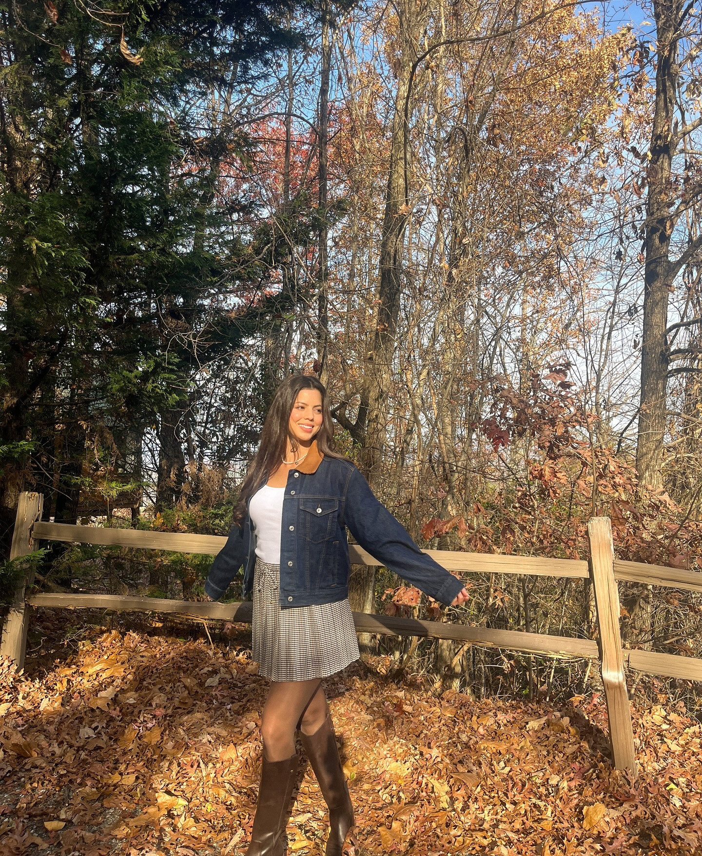 Soaking in the last golden days of fall ✨🍂  wearing denim trucker jacket, plaid pleated skirt, sheer brown tights, and brown leather riding boots

#LTKSeasonal #LTKCyberWeek #LTKSaleAlert