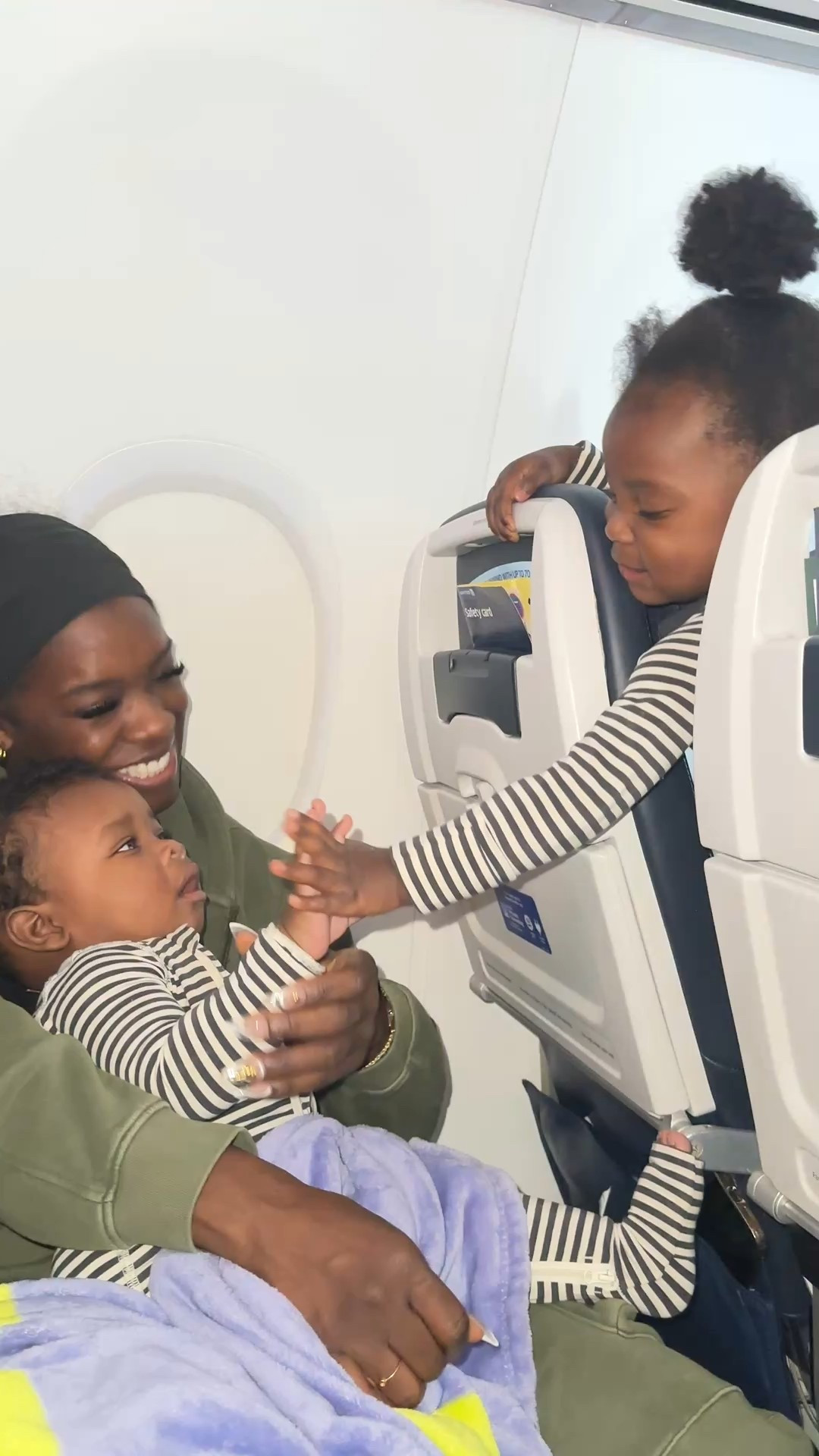 Window seat, matching stripes, sibling love at 30,000 feet.

#LTKWatchNow #LTKTravel #LTKBaby