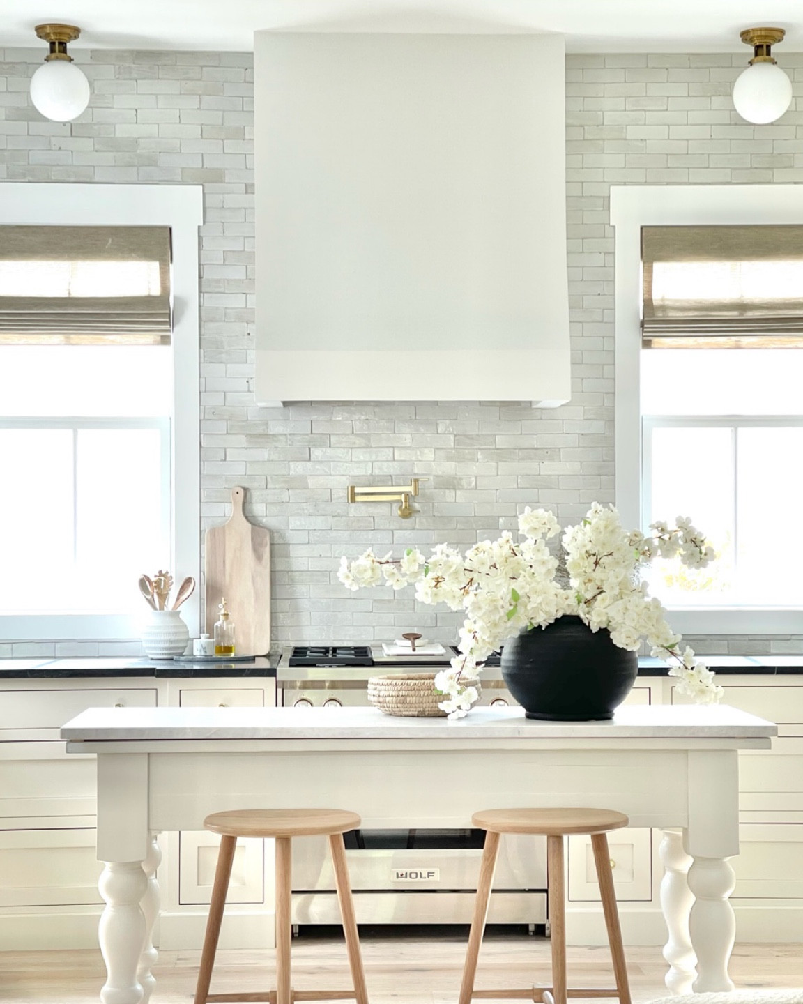 Kitchen decor, window shades, cutting board, wooden bar stools, black vase, wooden spoons 

#LTKhome #LTKunder50 #LTKFind