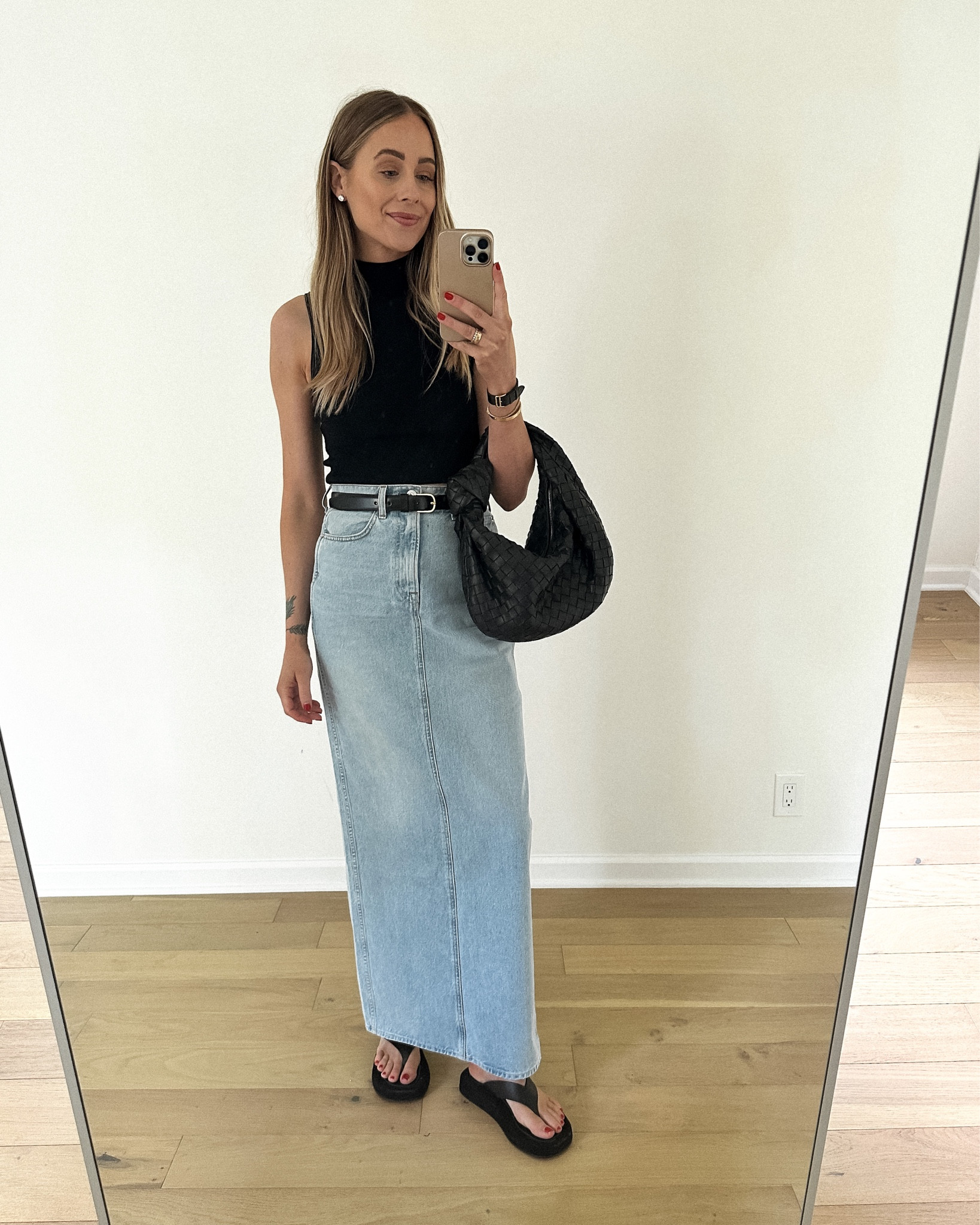 Fashion Jackson wearing black crop mock neck tank (small) denim maxi skirt (TTS /26) black belt, black flip flop platform sandals, black bottega bag #fashionjackson #denimskirt #maxiskirt #sandals 

#LTKstyletip #LTKunder100 #LTKshoecrush