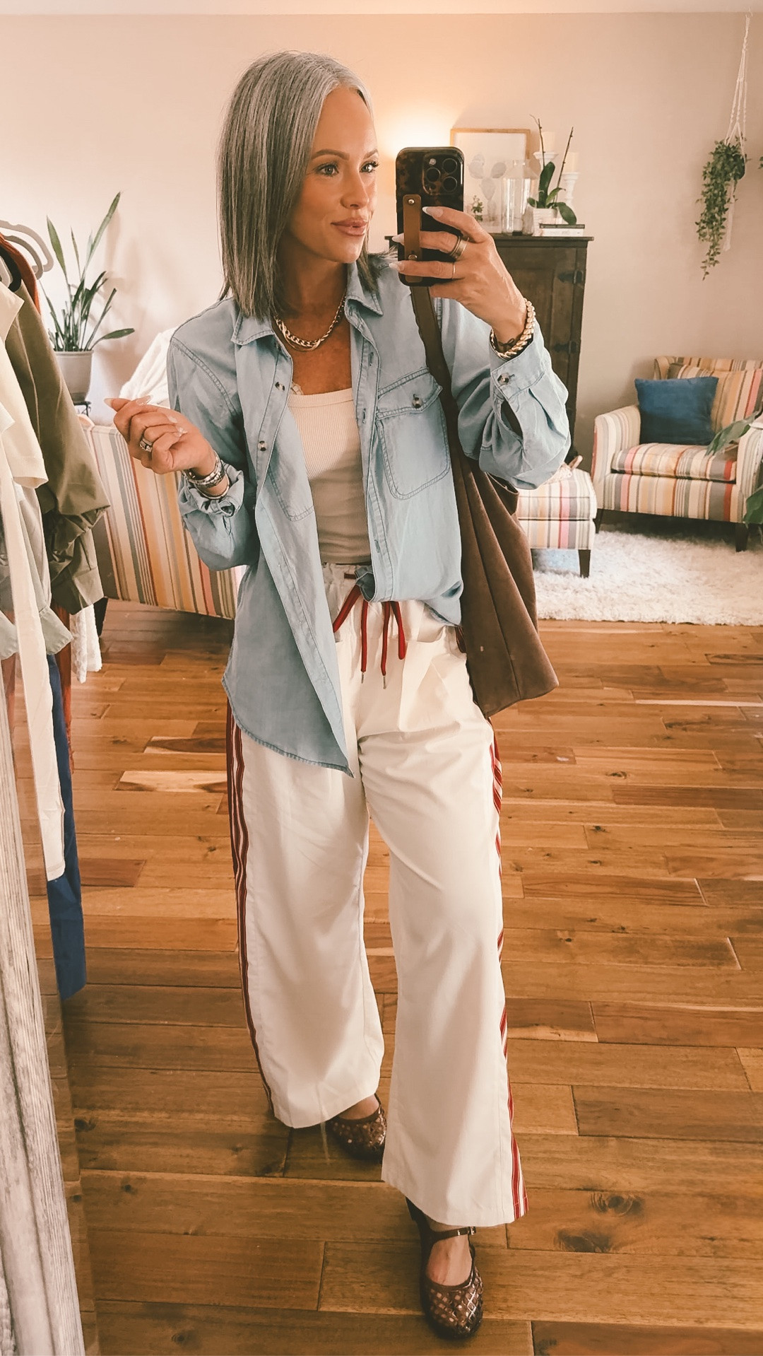 Medium and the pants they run pretty true to size, medium in the tank top and medium in the denim top. Shoes are true to size. #momstyle #trackpants #denimtop #fashionover40 #maryjanejellys #jellyshoes ￼

#LTKootd #LTKmomlife #LTKOver40