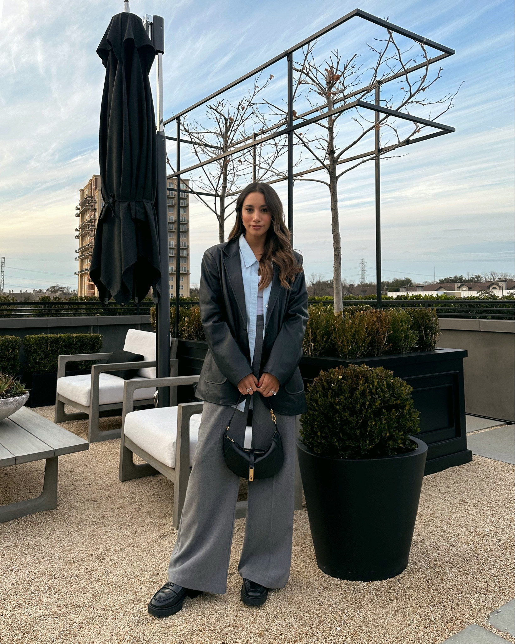 Abercrombie tailored pants + Anthropology faux leather blazer  — 
added a blue button down and a white bodysuit for a layered look — wearing coach Leah loafers and  Ralph Lauren bag 

#LTKworkwear #LTKSeasonal #LTKstyletip