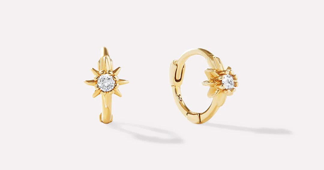 Inspired by the fiery color play of the sun, our Sun Huggie Hoops Elios will help you shine brigh... | Ana Luisa