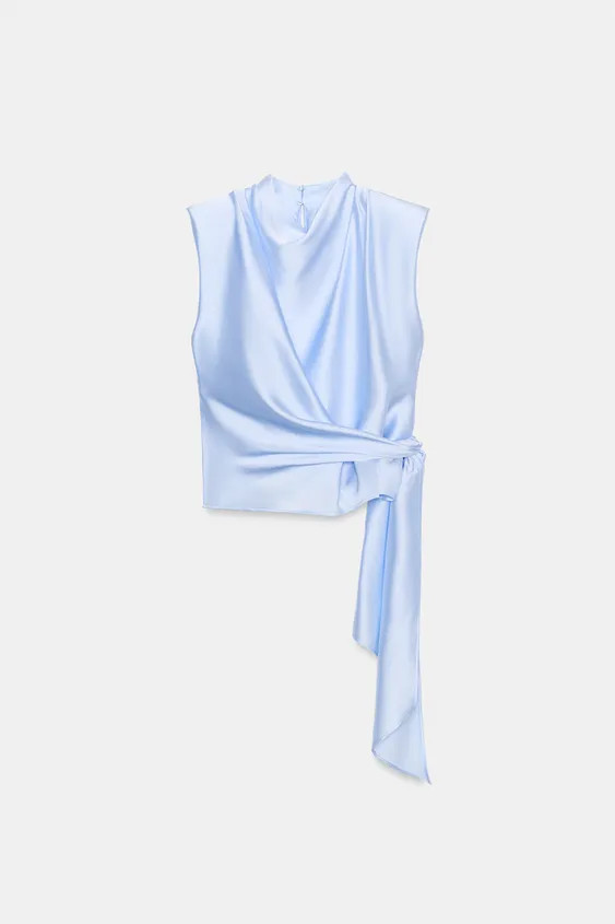High-neck, sleeveless top featuring shoulder pads and pleats. Knotted hem. Back opening with hidd... | Zara US