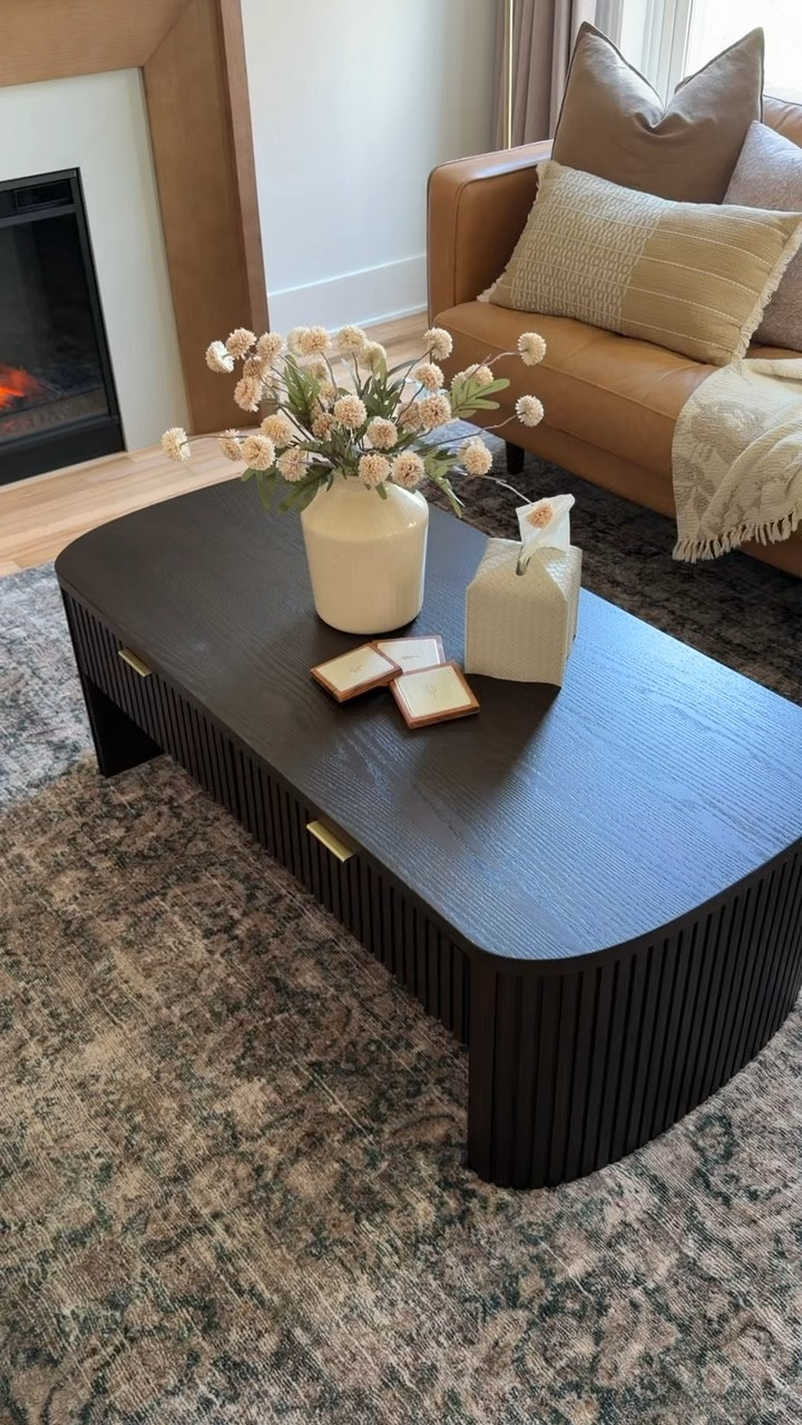 Black modern 48” oak veneer fluted solid wood coffee table from Wayfair - the perfect statement piece for our living room at our Airbnb. 

#Wayfairhome
#Airbnb
#modernhome