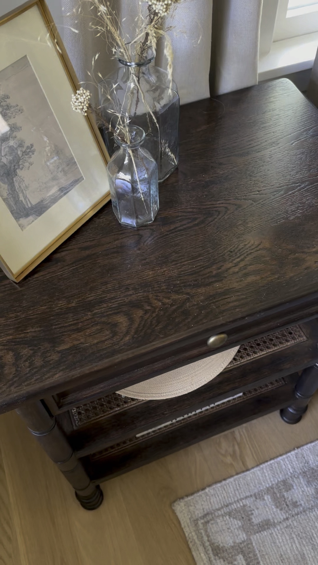 Giving you a taste of finishing touches to spaces ✨ Home takes time and these updates make all the difference to bring warmth in, thanks to @potterybarn 🤍 Shop each piece from my bio or my LTK! 
•
•
•
Dark wood nightstand, nightstand decor, home decor, woven rug, wood bed frame, coastal modern 

#LTKfindsunder50 #LTKsalealert #LTKhome