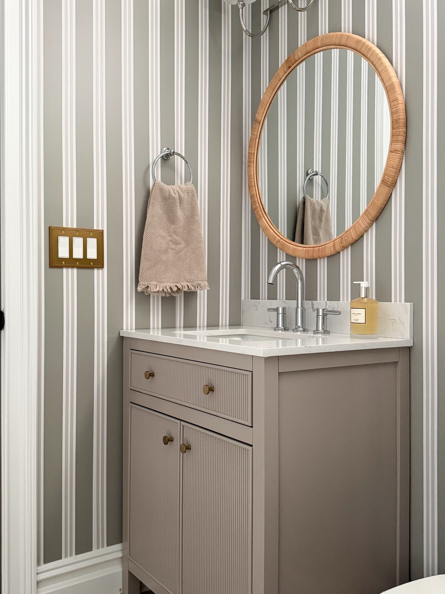 Little basement bathroom refresh thanks to the most beautiful wallpape! This wallpaper is peel-and-stick and was so much fun to install. Also sharing the vanity (you won’t believe how affordable it is!), rattan mirror and sconce that I installed!

#LTKHome #LTKSaleAlert #LTKdayinmylife
