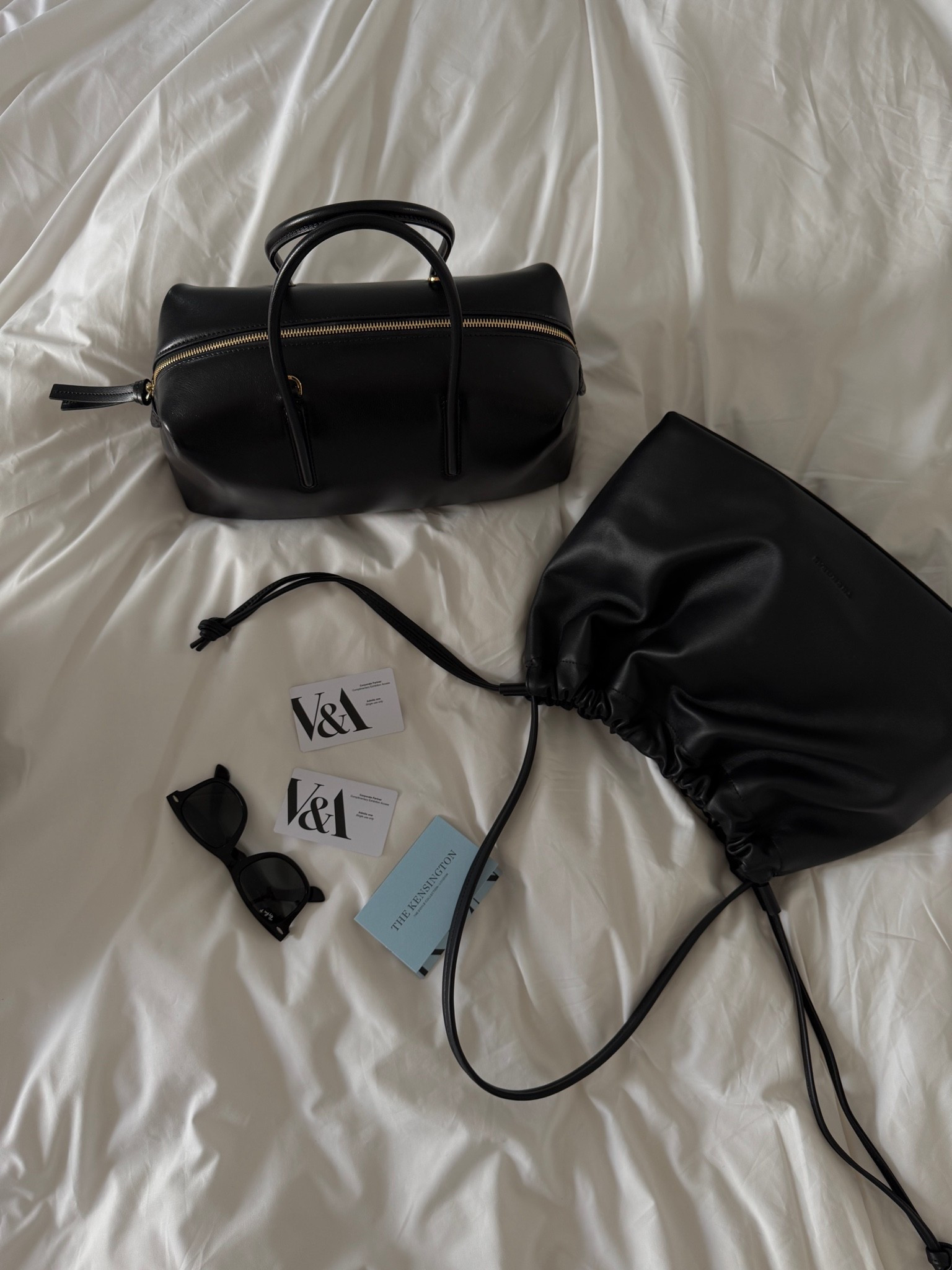 black leather duffle bag, structured bowling bag, gold hardware bag, black leather bucket bag, drawstring shoulder bag, black cat eye sunglasses, black round sunglasses, city travel essentials, London weekend, museum day, black bags edit, everyday carry, quiet luxury, elevated basics, ltkstyletip, ltkitbag, ltktravel, ltkfindsunder100, outfit inspo, capsule wardrobe essentials

#LTKtravel #LTKhome #LTKgiftguide